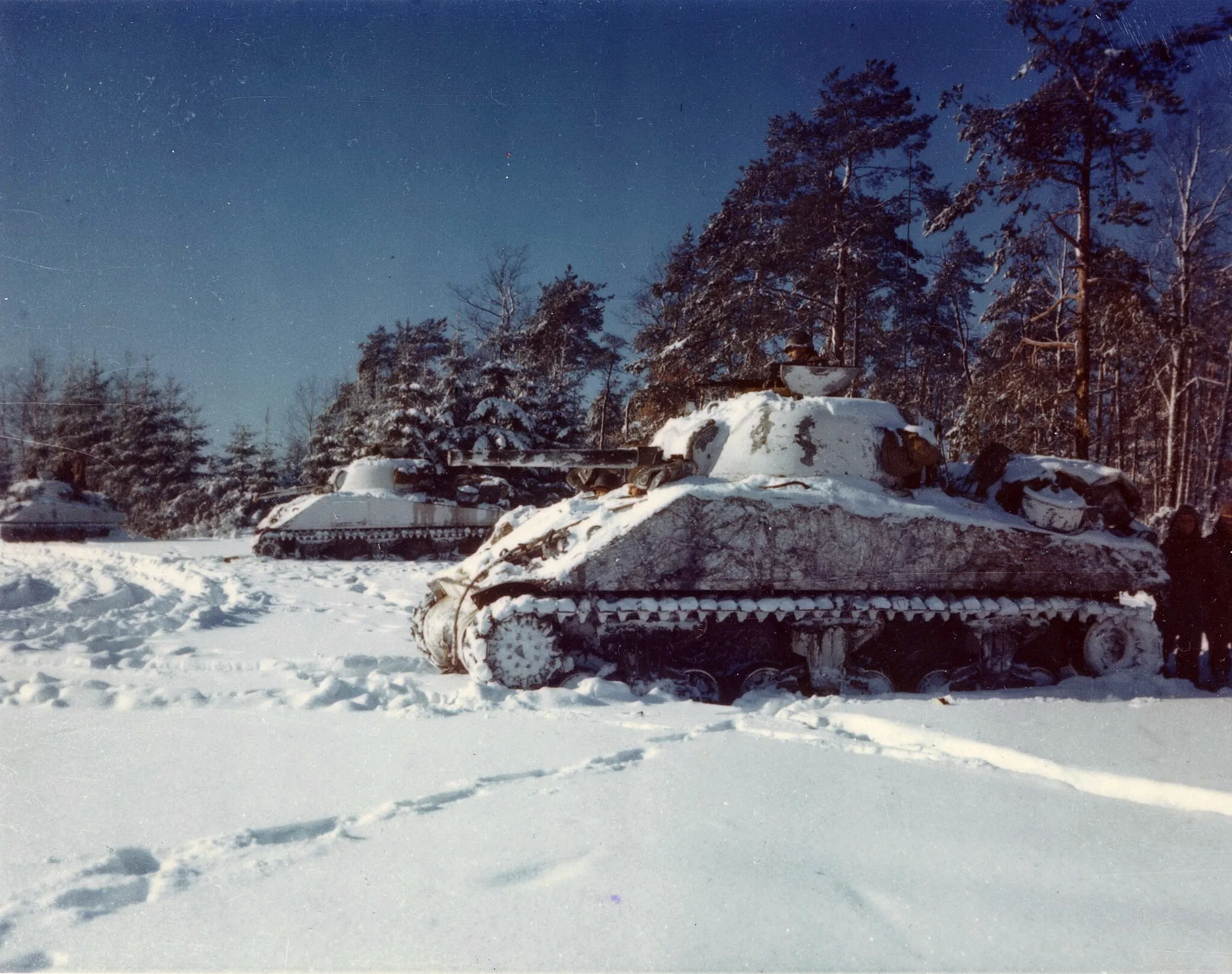 Photo showing: Original Caption: Lined up in a snow-covered field, near St. Vith, Belgium are the M-4 Sherman tanks of the 40th Tank Bn.
U.S. National Archives' Local Identifier: 111-C-714
Created by: Department of Defense. Department of the Army. Office of the Deputy Chief of Staff for Operations. U.S. Army Audiovisual Center. ca. 1974-5/15/1984
Scope and Content Note: Original caption: Lined up in a snow-covered field, near St. Vith, Belgium are the M-4 Sherman tanks of the10th Tank Bn.
Persistent URL: catalog.archives.gov/id/16730735
Repository: Still Pictures Unit, College Park,MD
Access Restrictions: Unrestricted

Use Restrictions: Unrestricted