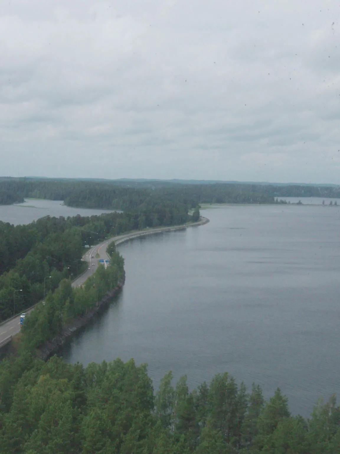 Photo showing: The road over Punkaharju ridge (highway 14) seen from the water tower in the village, in Punkaharju, Finland