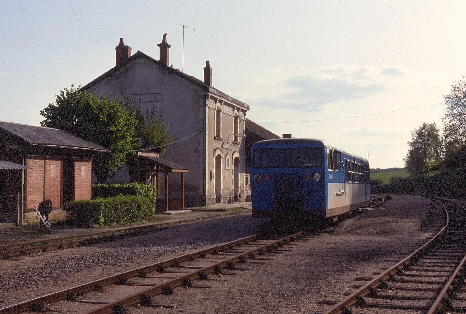Photo showing: The Chemin de Fer du Blanc-Argent was once an extensive metre gauge system in the Centre Region of France. Over the years it has been cut back extensively and was a particularly difficult system to cover thanks to low frequencies. On 3 May 1992, railcar X214 is seen at Luçay-le-Mâle on the 19:19 departure to Chabris. This section plus that onto Valençay closed in 2009. Despite this, the remaining section still open had new narrow gauge  railcars delivered in 2002.