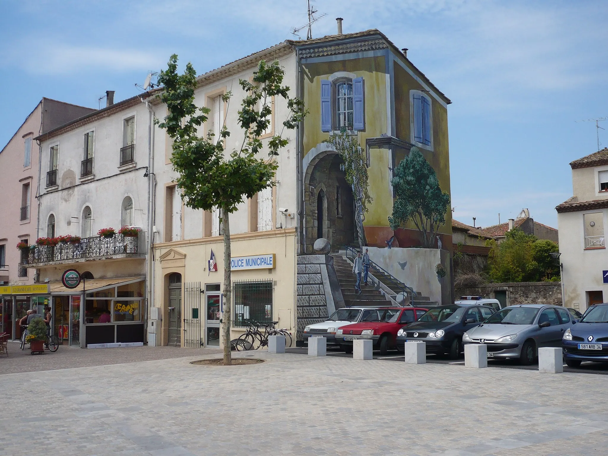 Photo showing: The main square in Villeneuve-le-beziers with distinct artwork