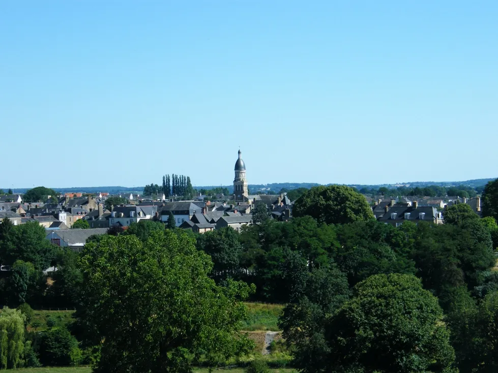 Photo showing: Ernee taken from the hill to the North of the town.  Old church centre of photo.