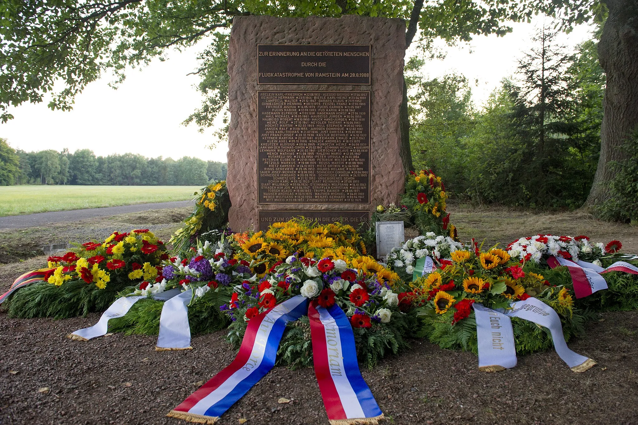 Photo showing: RAMSTEIN, Germany -- Wreaths lay at the memorial site of the 1988 Ramstein air show disaster, Aug. 28, 2013. People gathered on the 25th anniversary of the disaster to remember the 70 people who died when an Italian aerial demonstration team crashed during the show.