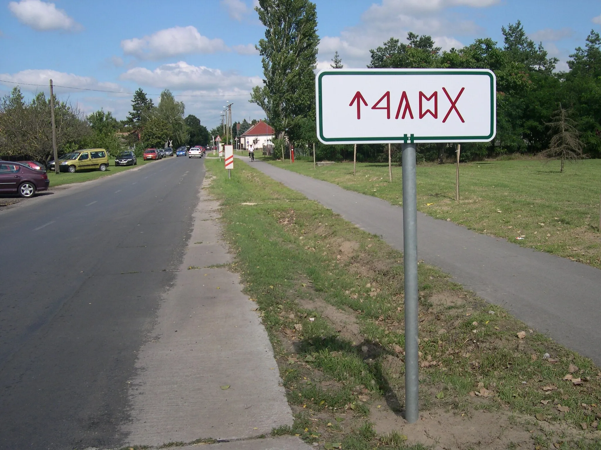 Photo showing: City limit table in Bugac, Hungary. Traditional hungarian letters (rovas), spelling bugac (right to left).