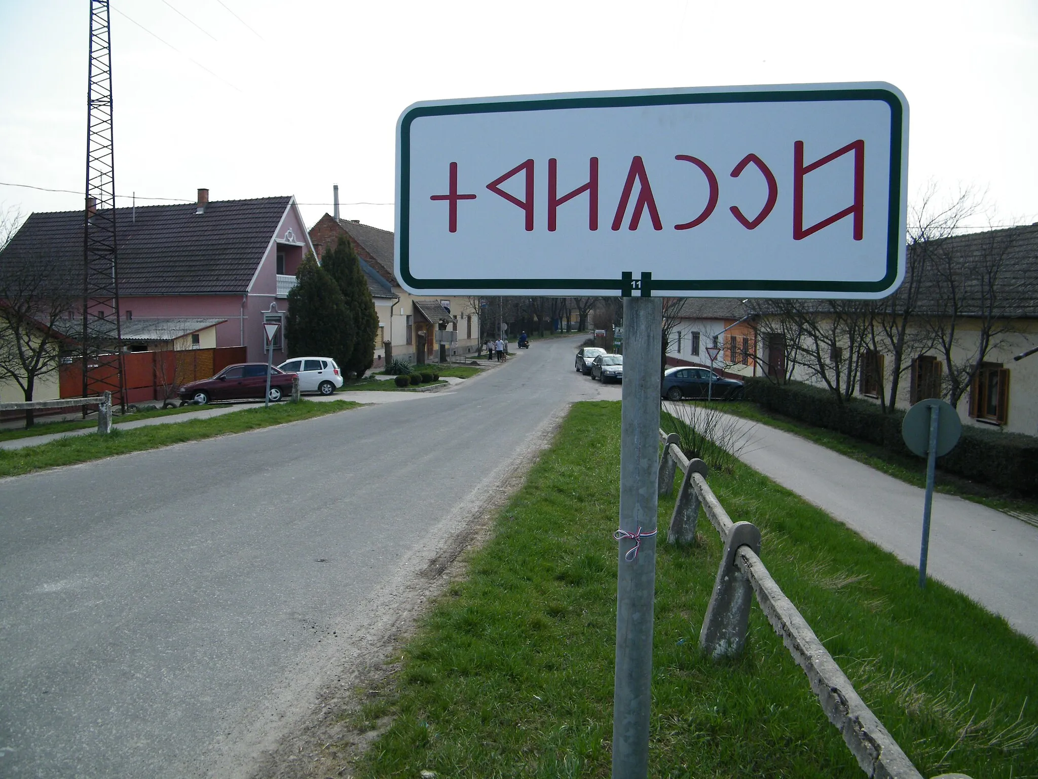 Photo showing: City limit table in Csongrad, Hungary. Traditional hungarian letters (rovas)