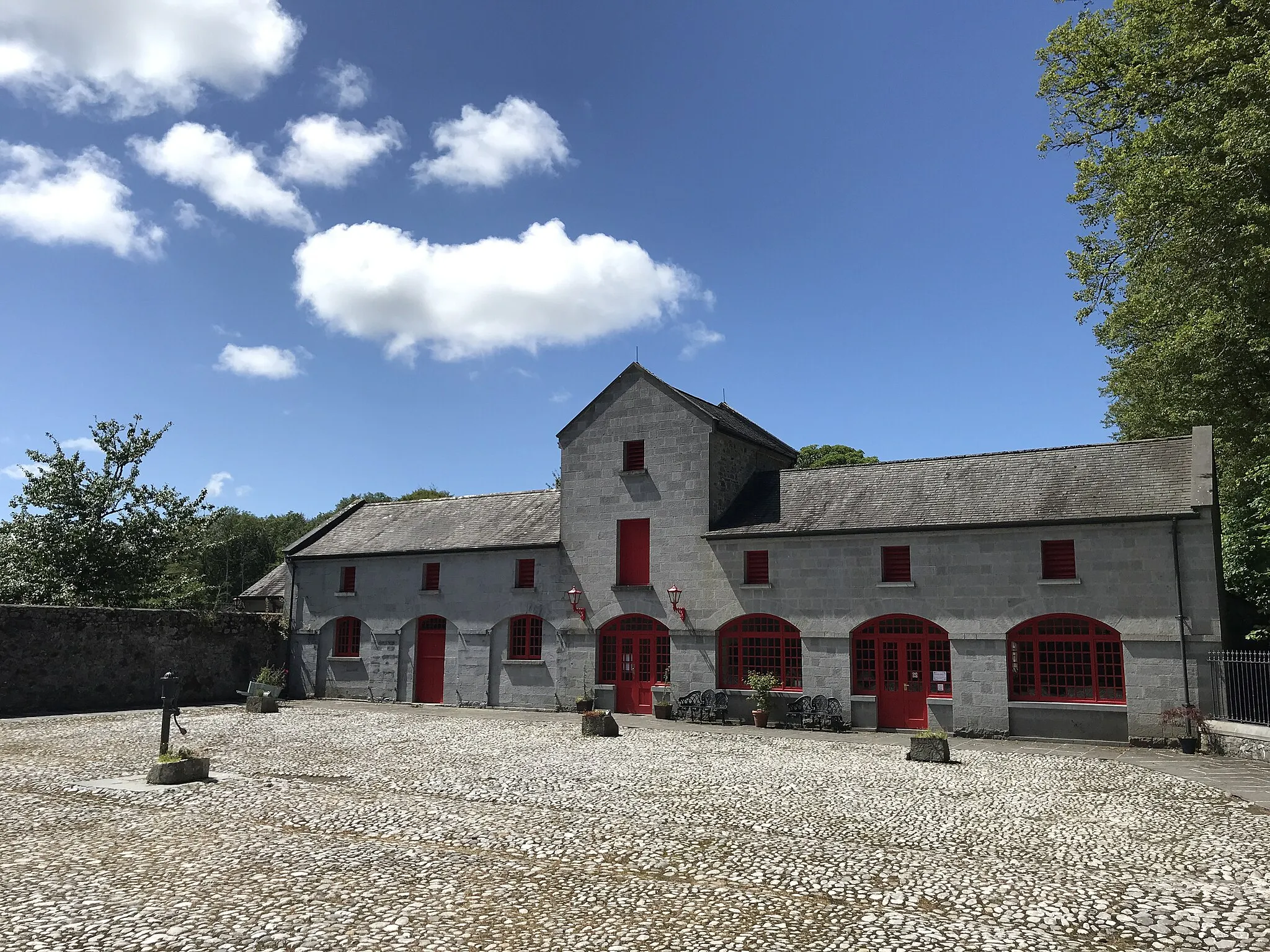 Photo showing: Beautiful, blue skies can be seen behind the Yard Stable/Visitor centre.
