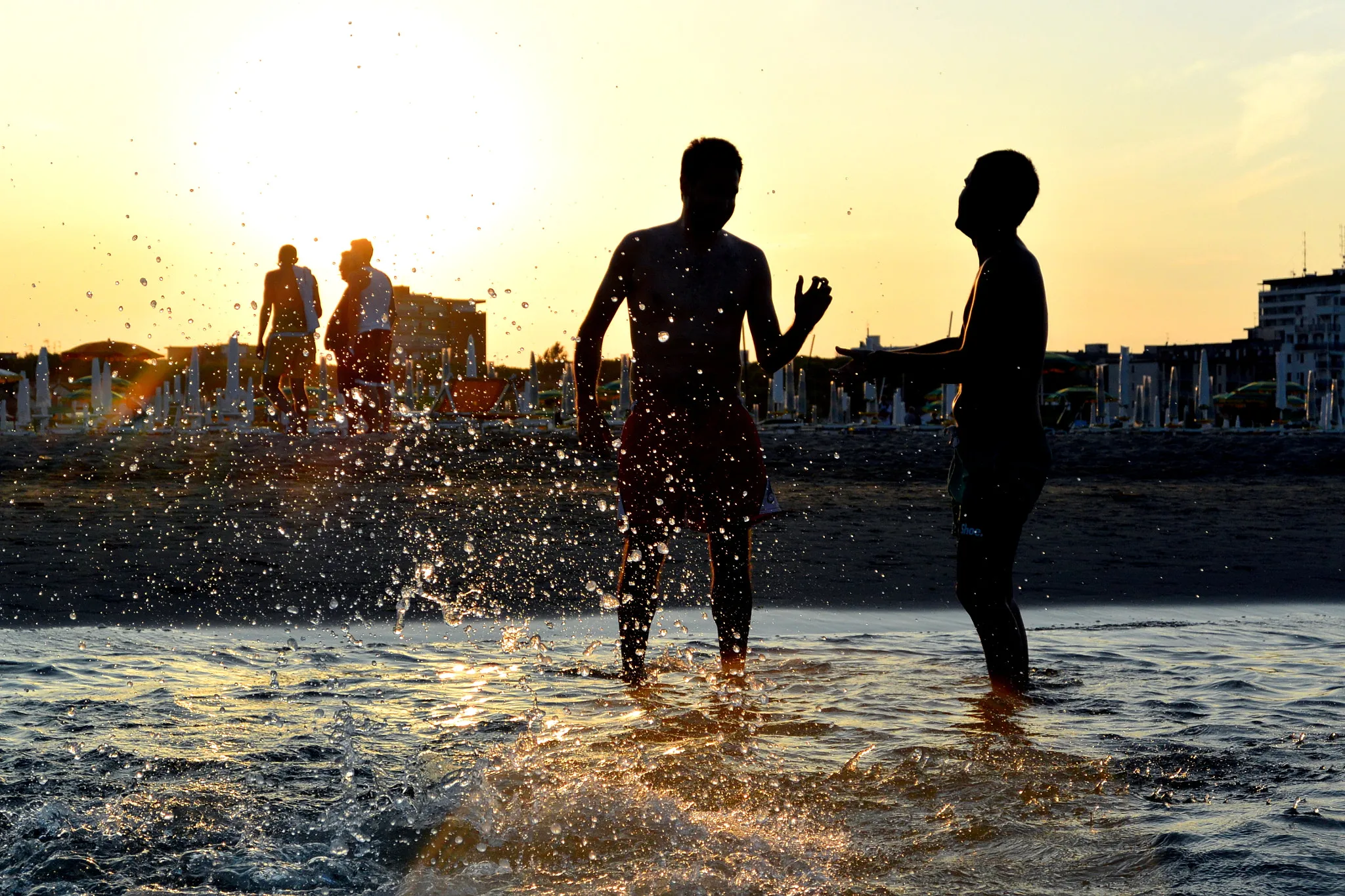 Photo showing: 500px provided description: Splash on sunset [#sunset ,#people ,#splash ,#see]