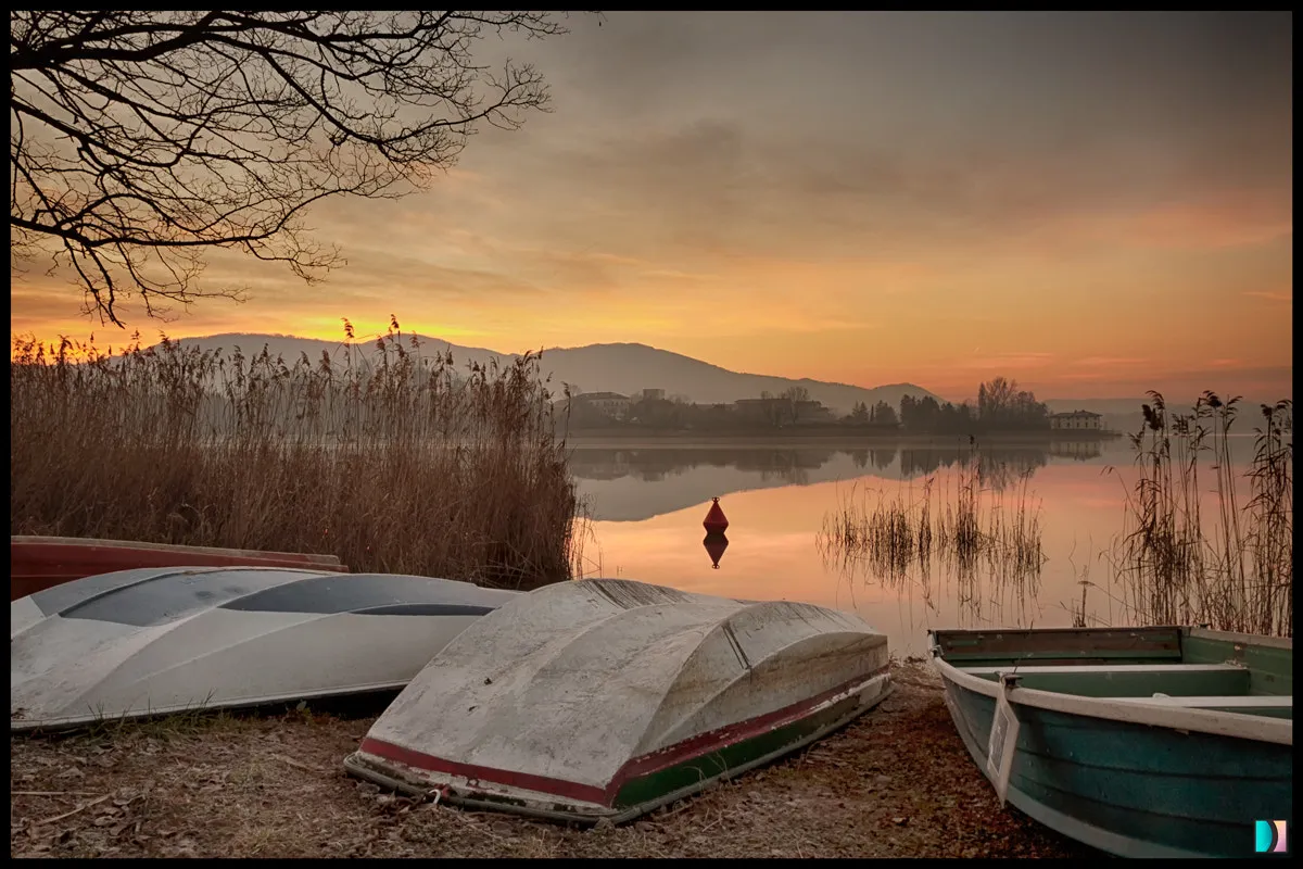 Photo showing: 500px provided description: I was looking for a nice place to photograph near home, I love lakes so my choice went in that direction.

A misty morning gave me a very beautiful atmosphere, long before the sunrise. [#sunrise ,#morning ,#lake ,#boat ,#reflection ,#misty ,#emidellizuani]