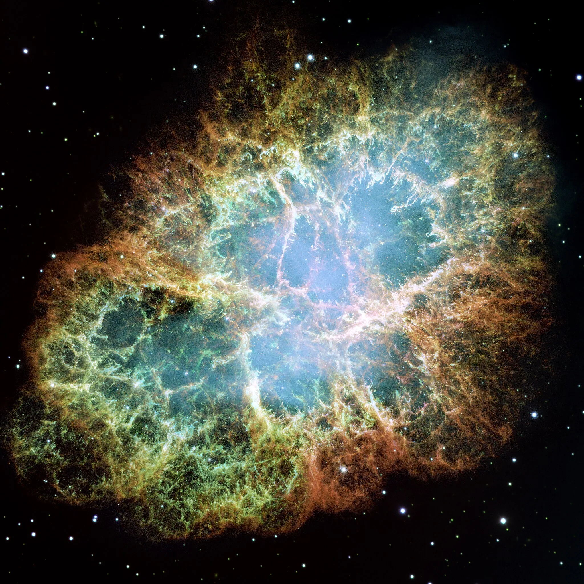 Photo showing: This is a mosaic image, one of the largest ever taken by NASA's Hubble Space Telescope, of the Crab Nebula, a six-light-year-wide expanding remnant of a star's supernova explosion. Japanese and Chinese astronomers recorded this violent event in 1054 CE.
The orange filaments are the tattered remains of the star and consist mostly of hydrogen. The rapidly spinning neutron star embedded in the center of the nebula is the dynamo powering the nebula's eerie interior bluish glow. The blue light comes from electrons whirling at nearly the speed of light around magnetic field lines from the neutron star. The neutron star, like a lighthouse, ejects twin beams of radiation that appear to pulse 30 times a second due to the neutron star's rotation. A neutron star is the crushed ultra-dense core of the exploded star.
The Crab Nebula derived its name from its appearance in a drawing made by Irish astronomer Lord Rosse in 1844, using a 36-inch telescope. When viewed by Hubble, as well as by large ground-based telescopes such as the European Southern Observatory's Very Large Telescope, the Crab Nebula takes on a more detailed appearance that yields clues into the spectacular demise of a star, 6,500 light-years away.

The newly composed image was assembled from 24 individual Wide Field and Planetary Camera 2 exposures taken in October 1999, January 2000, and December 2000. The colors in the image indicate the different elements that were expelled during the explosion. Blue in the filaments in the outer part of the nebula represents neutral oxygen, green is singly-ionized sulfur, and red indicates doubly-ionized oxygen.
