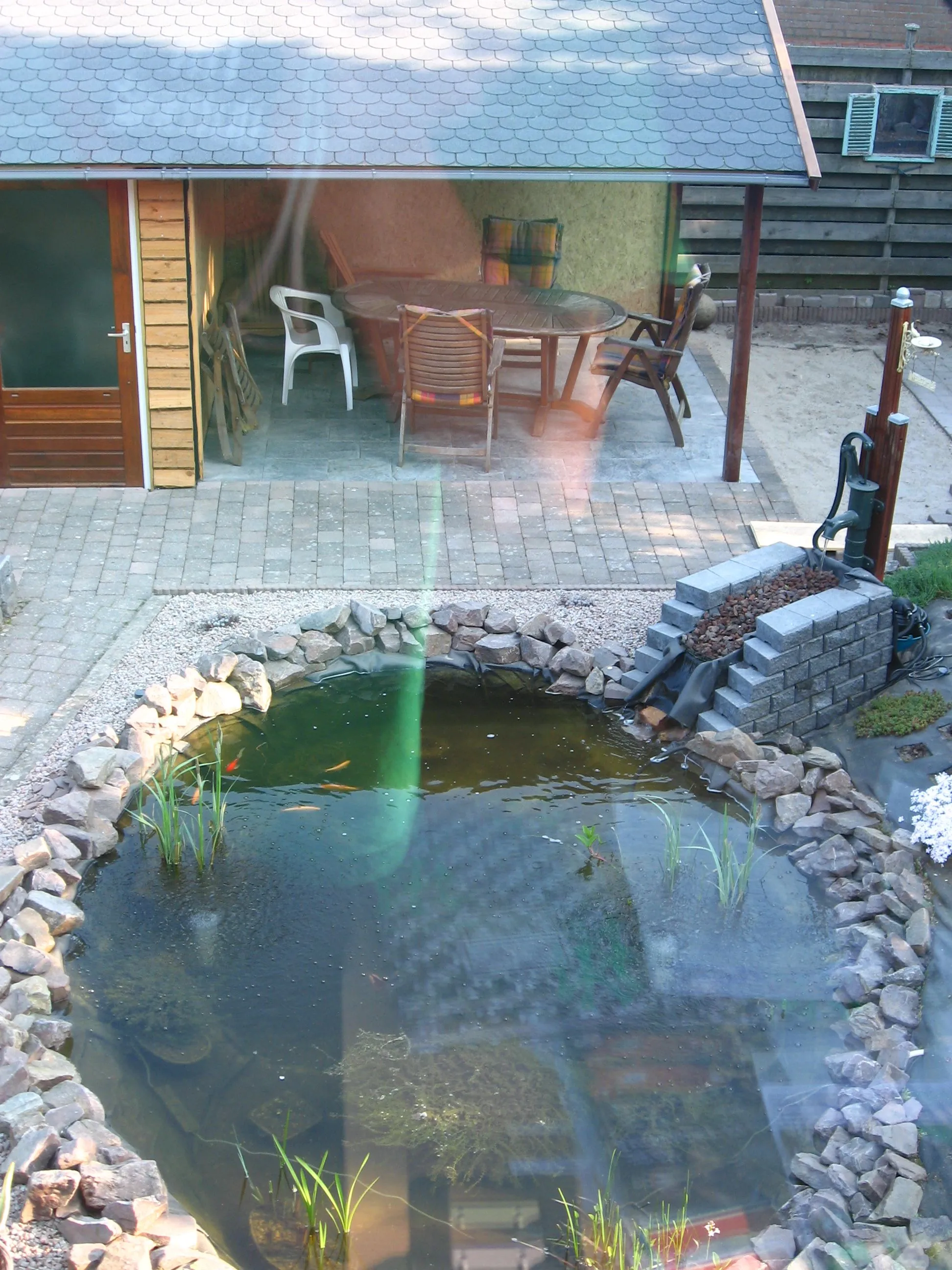 Photo showing: Upper view of the pond in the backyard