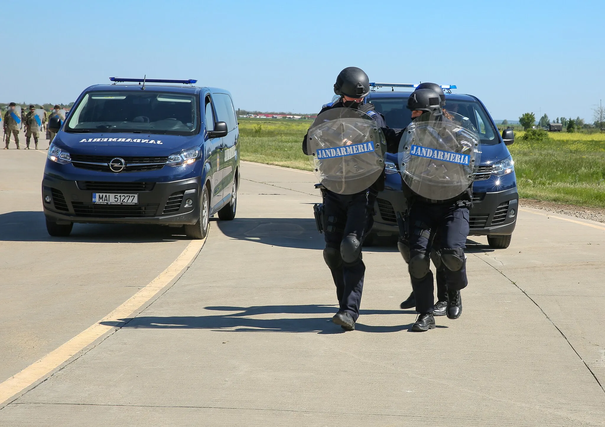 Photo showing: Members of the Romanian Jandarmeria Military Police move in formation to a protest during Swift Response 21 in Boboc, Romania, May 11, 2021. Swift Response 21 is a Defender 21 linked exercise, an annual large-scale US Army-led, multinational, joint exercise designed to build readiness and interoperability between US, NATO, and partner militaries. (U.S. Army photo by Sgt. Randis Monroe)