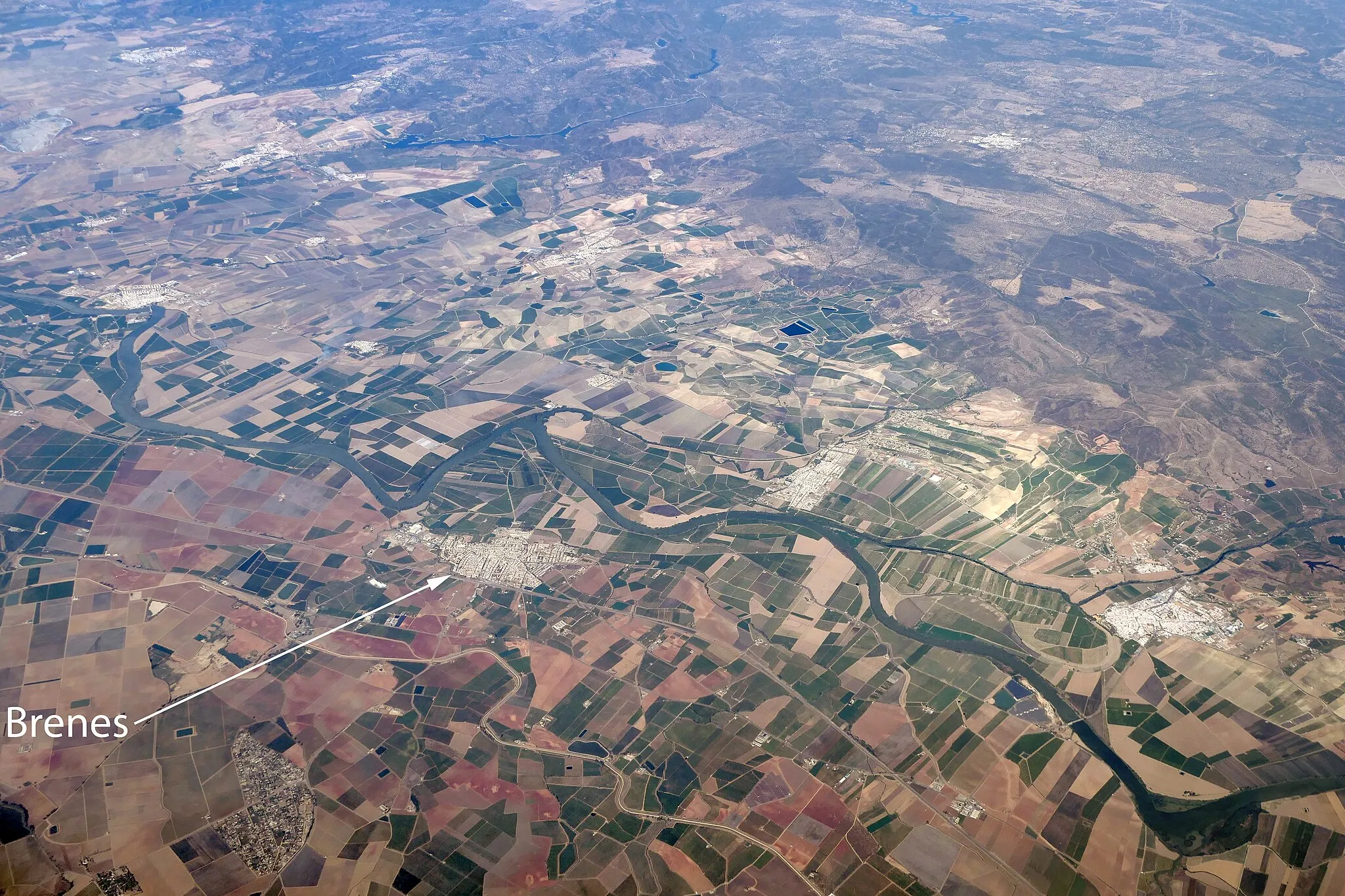 Photo showing: An aerial view of Brenes in Andalusia, Spain, and the countryside around it.