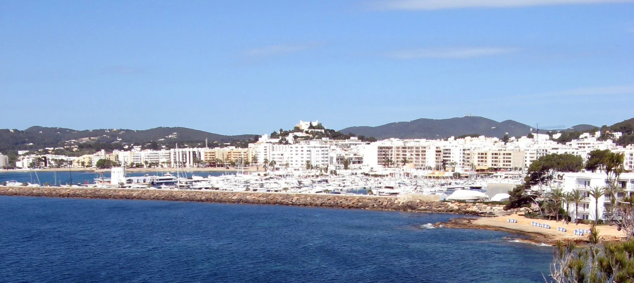 Photo showing: Port and town of Santa Eulària des Riu from the north east