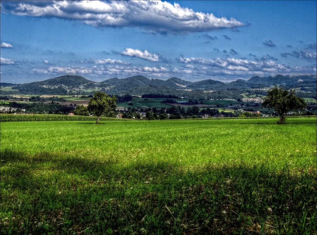 Photo showing: View from Röschenz towards Laufen and the hills of the "Schwarzbubenland"