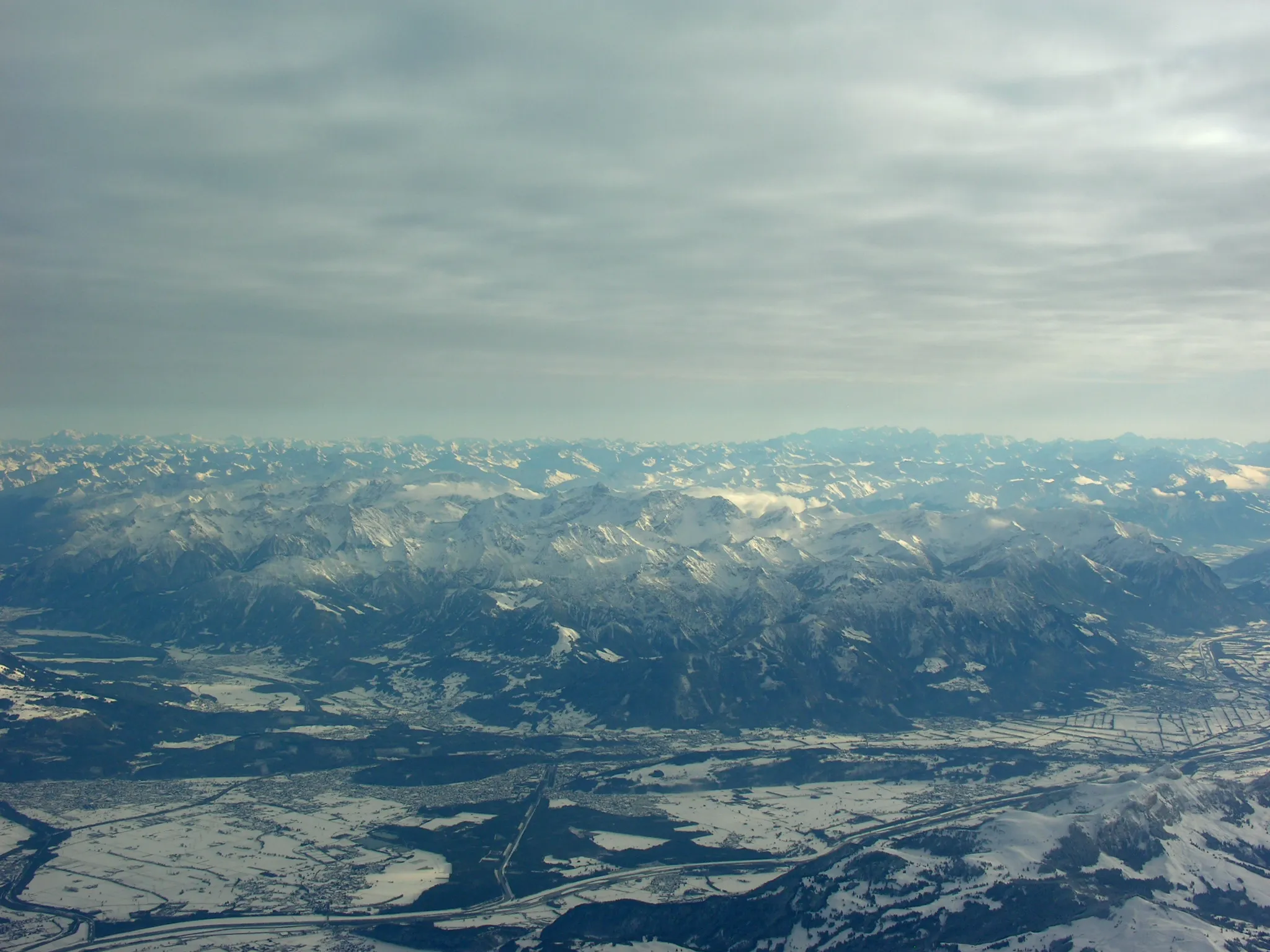 Photo showing: Aerial View of Rhine Valley and Austrian Alps from overhead Mörschwil at 4670 m asl