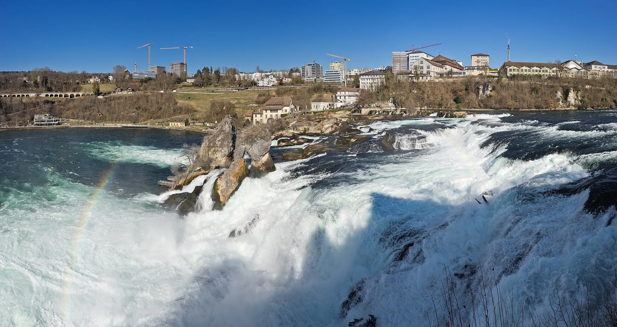 Photo showing: View of the Rhine Falls and Neuhausen from one of the viewpoints on the south side.