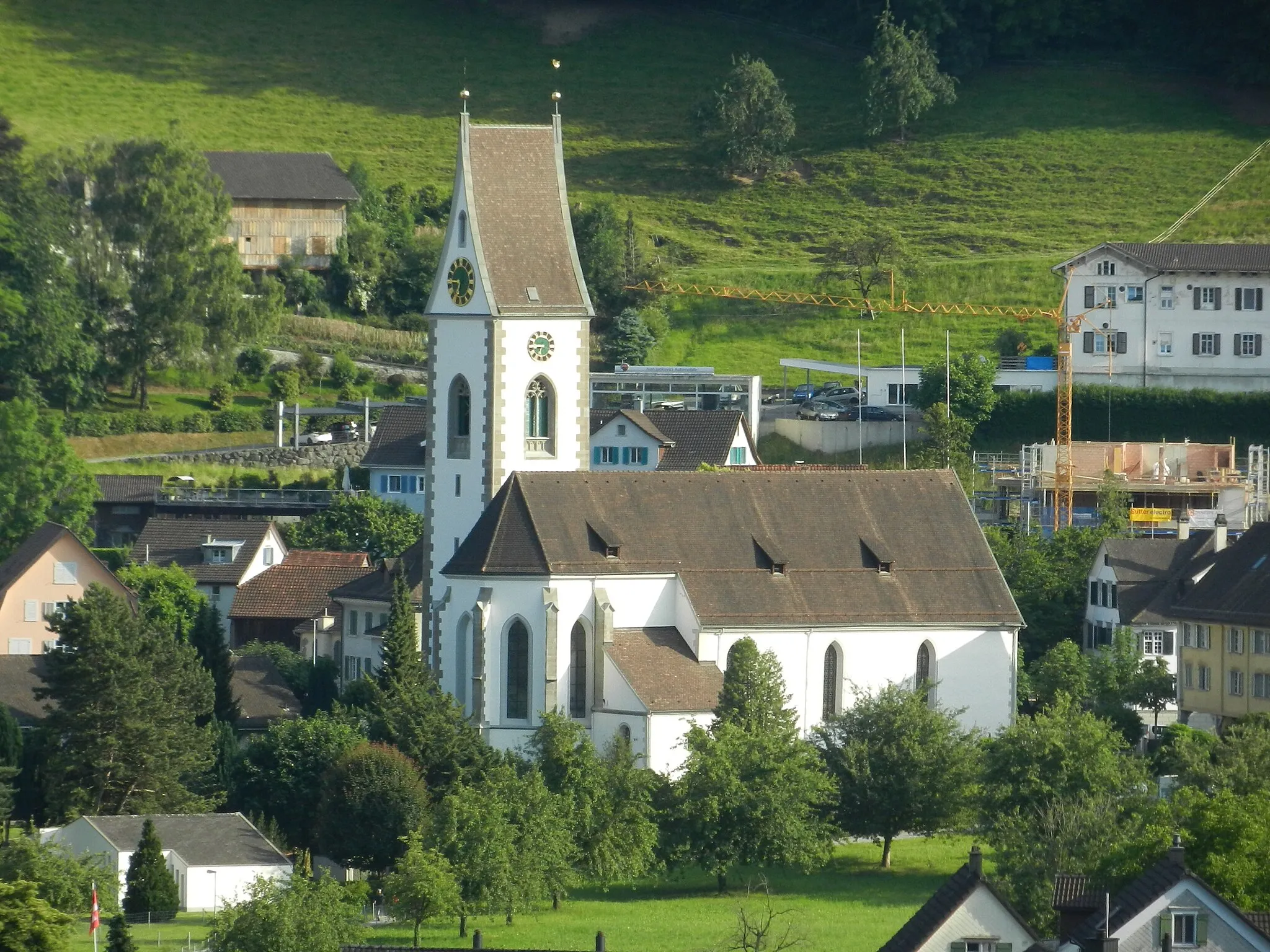Photo showing: Die Paritätische Kirche Thal SG steht an der Dorfstrasse, mitten im Ortsteil Thal. Aufnahme vom Buchberg, d.h. von der Nordseite.