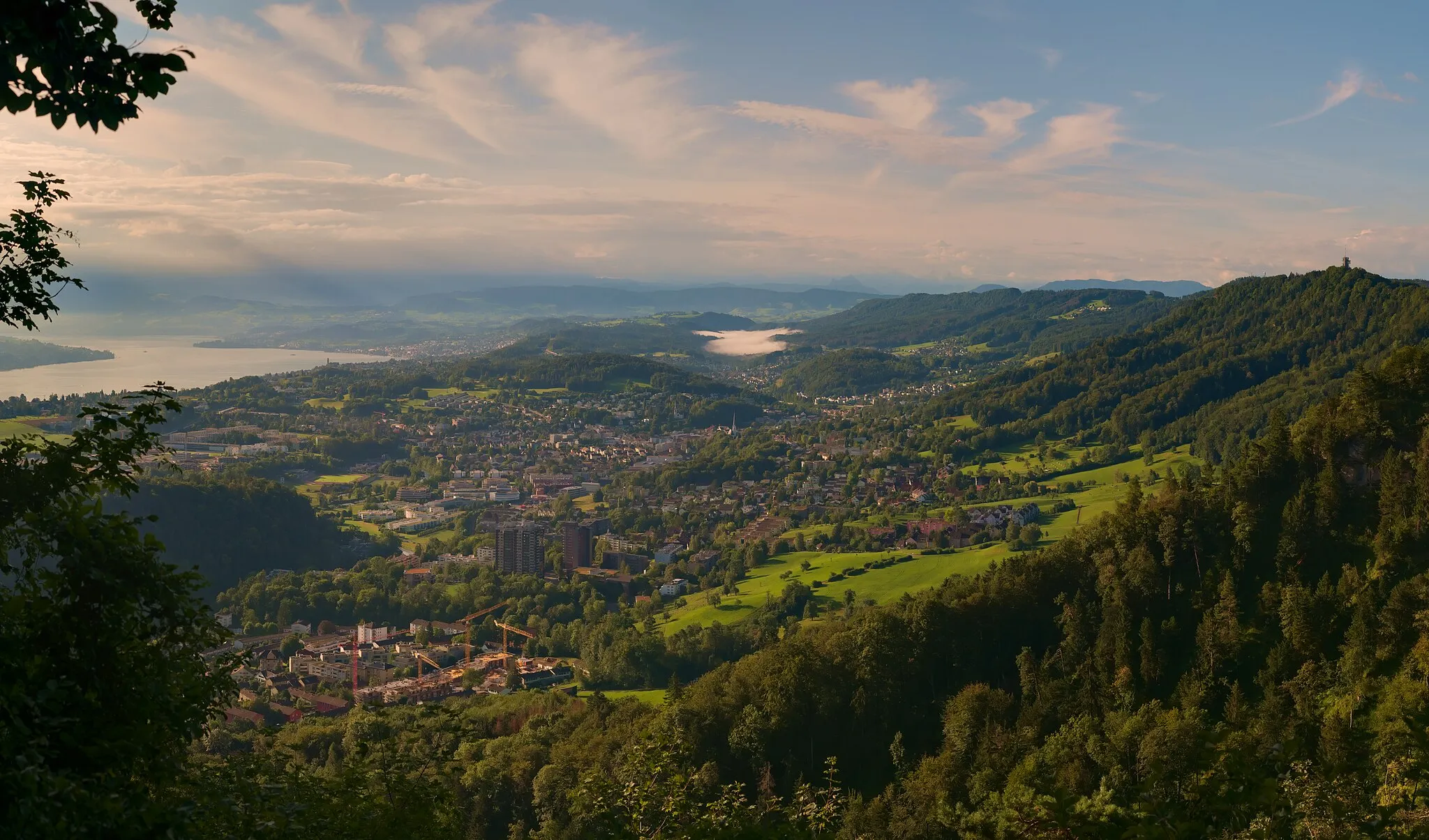 Photo showing: Adliswil and the Sihl valley (Leimbach in the front, Langnau and Albispass in the back) from the northern side of Fallätsche (near the Teehüsli).  This panorama was blended from two exposure layers with 19 images each, and thus consists of a total of 38 individual exposures.