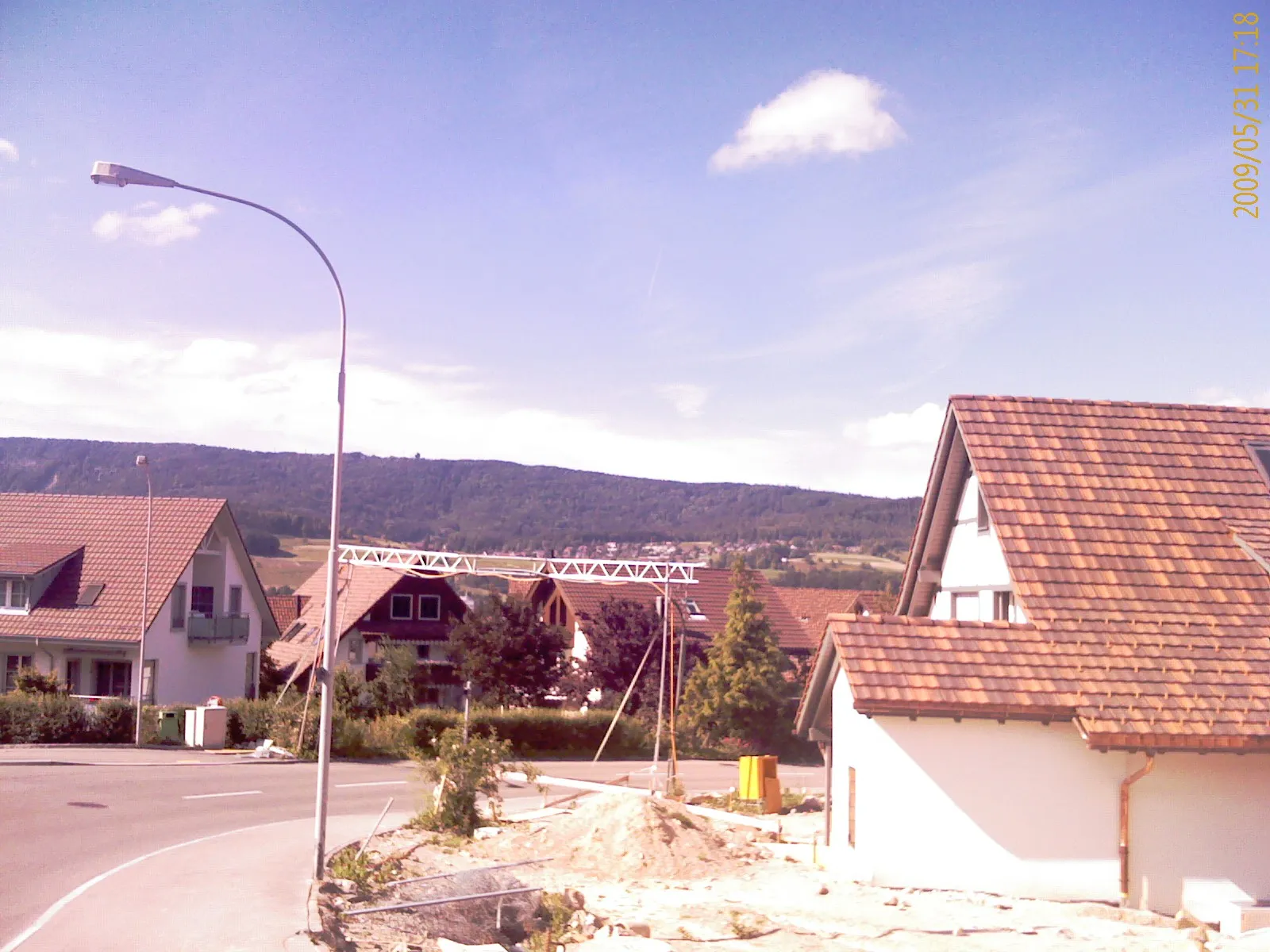 Photo showing: Dänikon and in the back the mountain chain Lägern, canton of Zürich, Switzerland