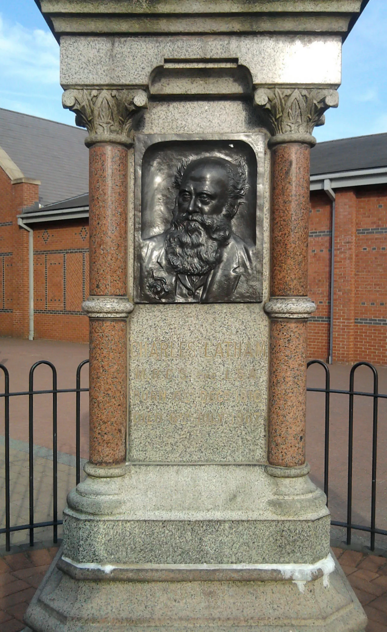 Photo showing: Charles Latham MRCS LSA (1816-1907) public memorial statue/monument in Sandbach, Cheshire, between Ashfields and Aldi. A "Surgeon General Practitioner" [1] (physician), he was born in Sandbach on 6 Dec 1816 (the son of Richard and Sarah Latham, [2]), he married Mary Newham, and died in Sandbach on 6 July 1907 aged 90. He held Membership of the Royal College of Surgeons, and was a Licenciate of the Society of Apothecaries.