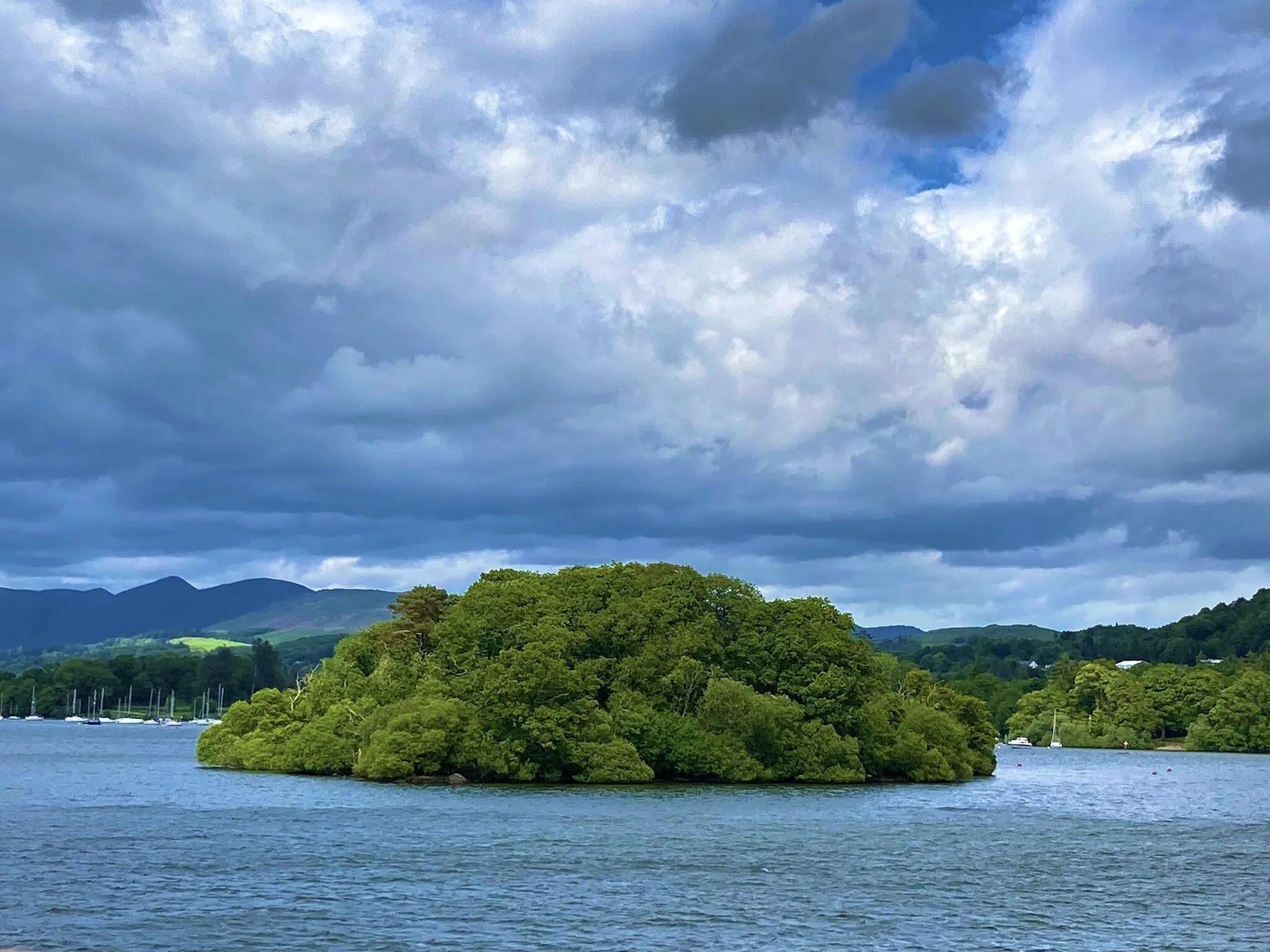 Photo showing: Ramp Holme is one of several islands on Windermere, the largest lake in England. This photograph was taken from a boat on the lake.