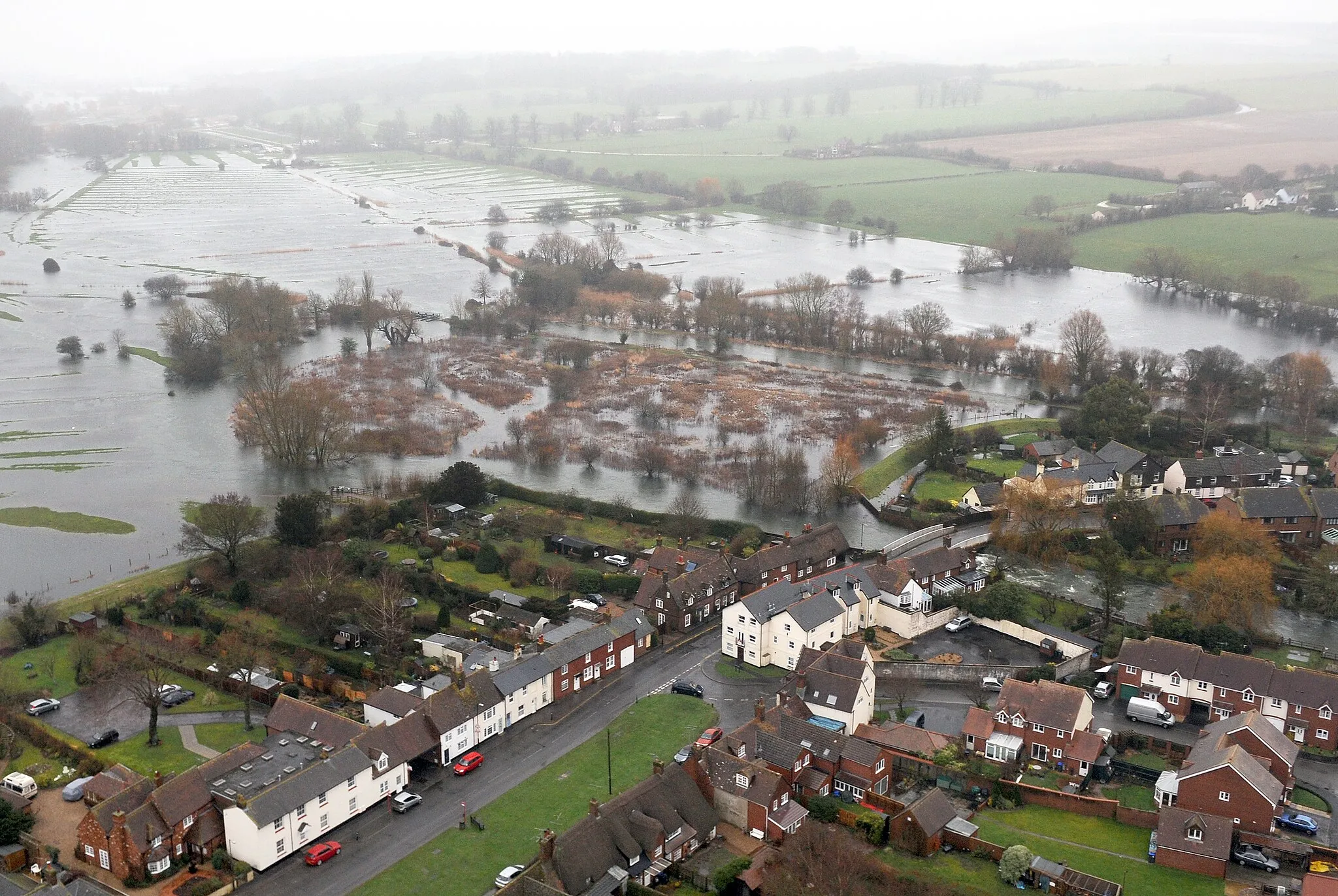 Photo showing: [Correction: the location has been identified by the Unidentified photos of the British Isles Group on Facebook as Downton in Wiltshire. See Google Street view for confirmation.]
Flooding hits a town in Oxfordshire during the widespread floods of February 2014.
The RAF's Puma and Merlin Helicopter Forces joined the UK flood relief operation, supporting efforts on the ground from the skies above the south of England.

Organization: RAF
Object Name: BEN-UNCLASS-20140214-138-090
Category: MOD
Supplemental Categories: Operations, Humanitarian
Keywords: Oxfordshire, Flooding, Flood, Humanitarian, Relief, Aid, Help, Assistance, Town, Village, Flooded, Water
Country: England