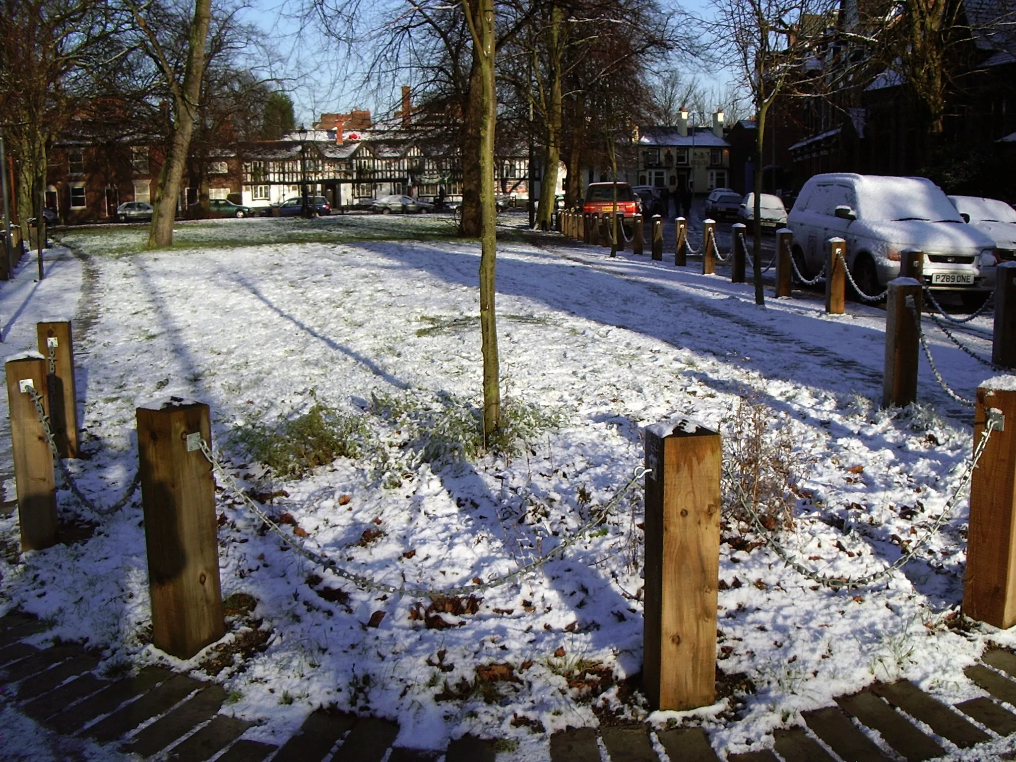 Photo showing: Chorlton Green Looking north from the southern tip of the green towards the black and white front of the Horse & Jockey.