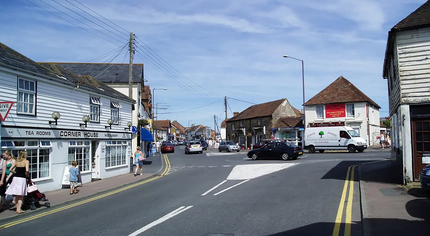 Photo showing: A view of the High Street at Dymchurch, Kent, UK, looking from Eastbridge Road.