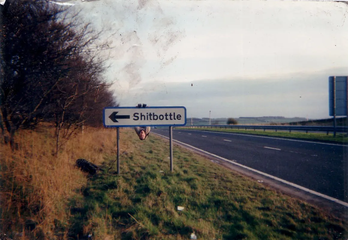 Photo showing: In recent years, road signs to the village have been altered by the method of 'crossing' the first 'l' in 'shilbottle' to make it appear as a 't' on road signs, thus making it read as Shitbottle.