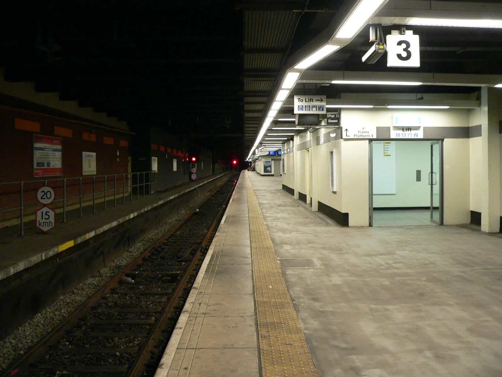 Photo showing: Sunderland station is shared between the Tyne and Wear Metro system and mainline services, platform 3 in the foreground is for Northbound Metro services to Newcastle, platform 4 in the distance (beyond the first signal) is for Northbound mainline services, also towards Newcastle.
The two numbered signs on the left of the track are speed restriction signs - the indicating the top speed for mainline trains is 20mph, while the lower one restricts Metro services to 15km/h.