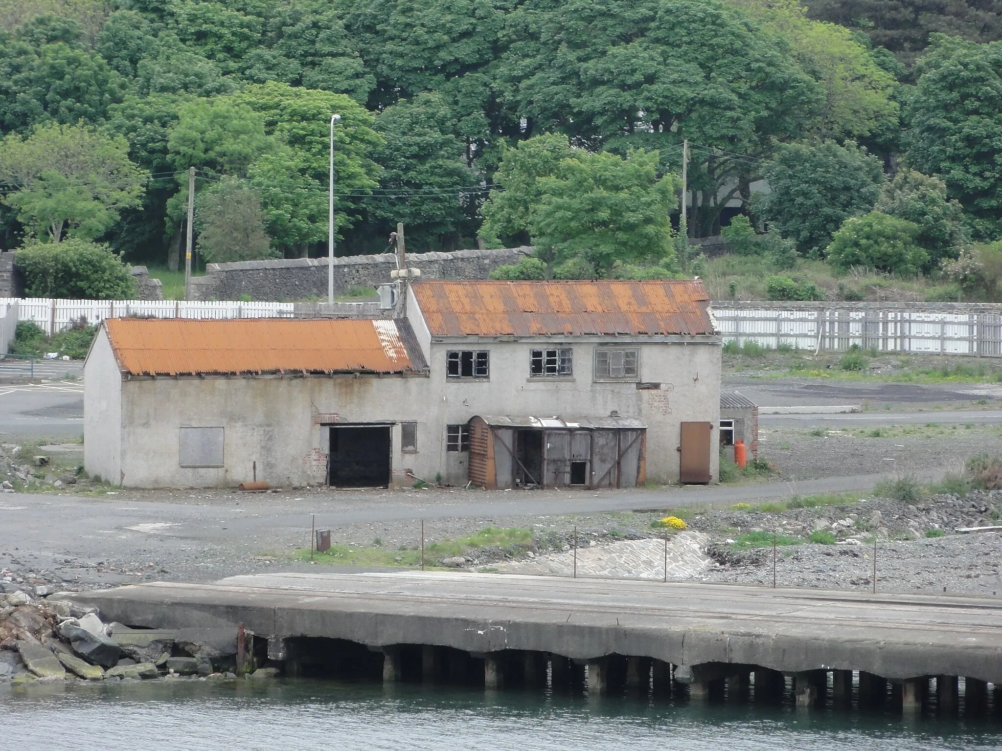 Photo showing: Abandoned buildings and pier