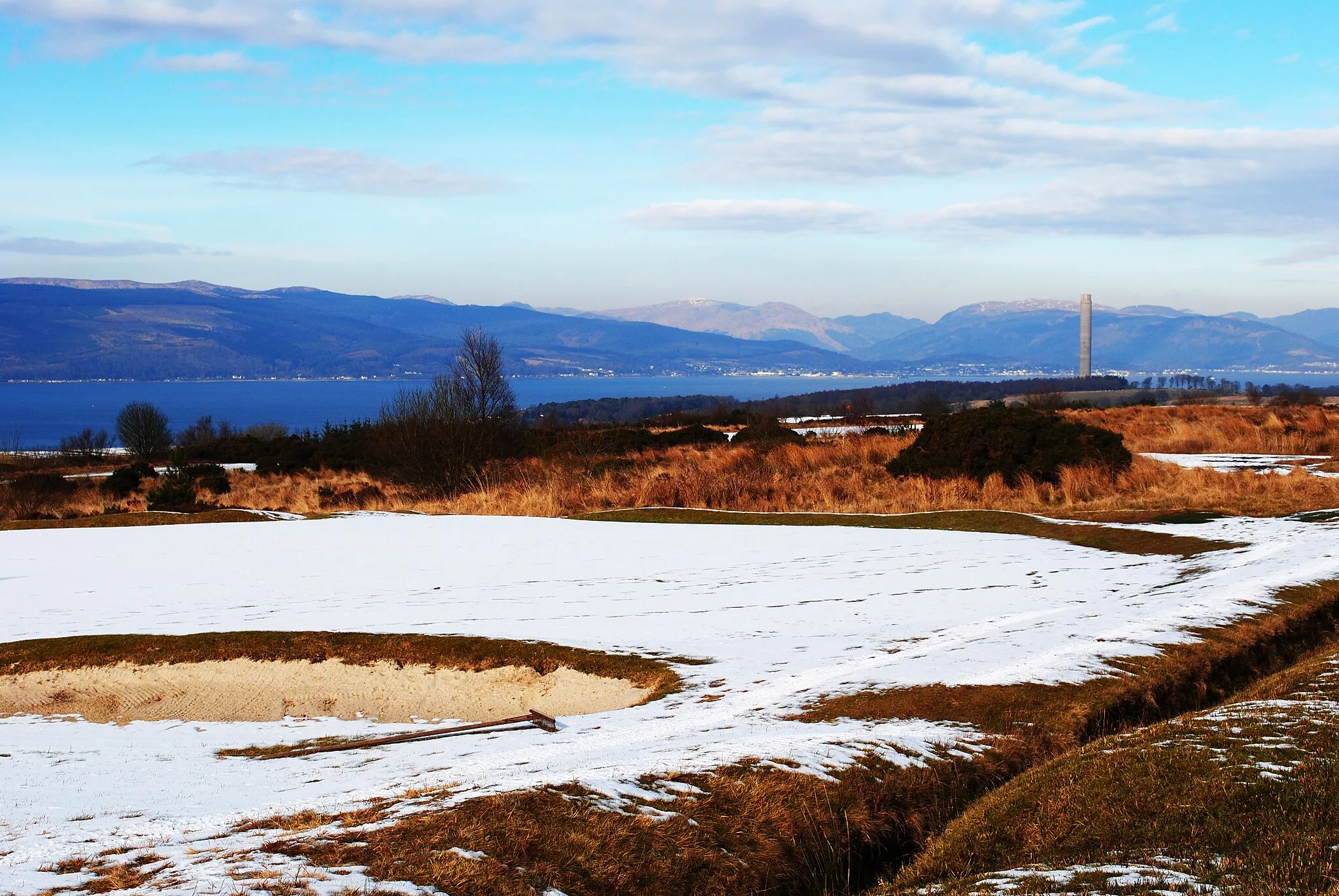 Photo showing: Bunker on Skelmorlie golf course Winter still hanging around on Skelmorlie Golf Course. Inverkip Chimney in the background.