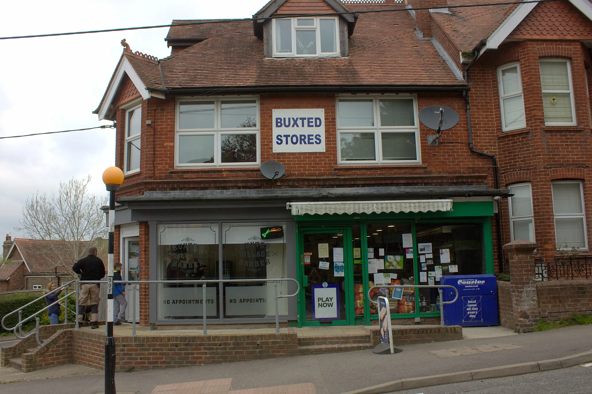 Photo showing: Buxted stores and the Village Barber