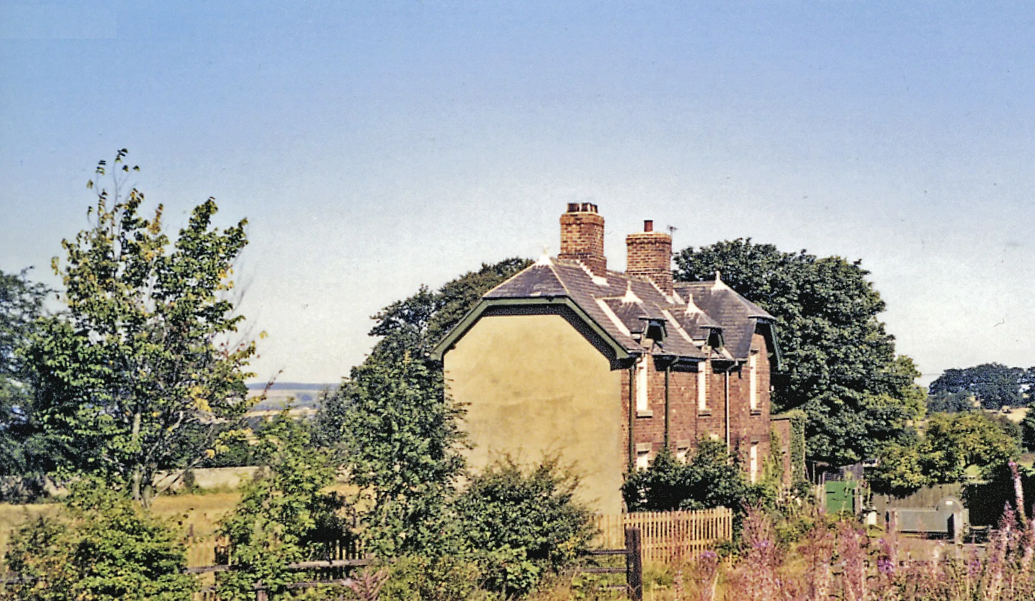 Photo showing: Coundon station (remains), 1991.
View eastward, towards Spennymoor and Ferryhill: ex-North Eastern Ferryhill - Bishop Auckland branch, the line running behind the surviving house. The station closed to passengers 4/12/39, when the service was withdrawn between Bishop Auckland and Spennymoor (to Ferryhill 31/3/52. Coundon closed to goods in 5/48, but freight traffic continued through until 9/56.