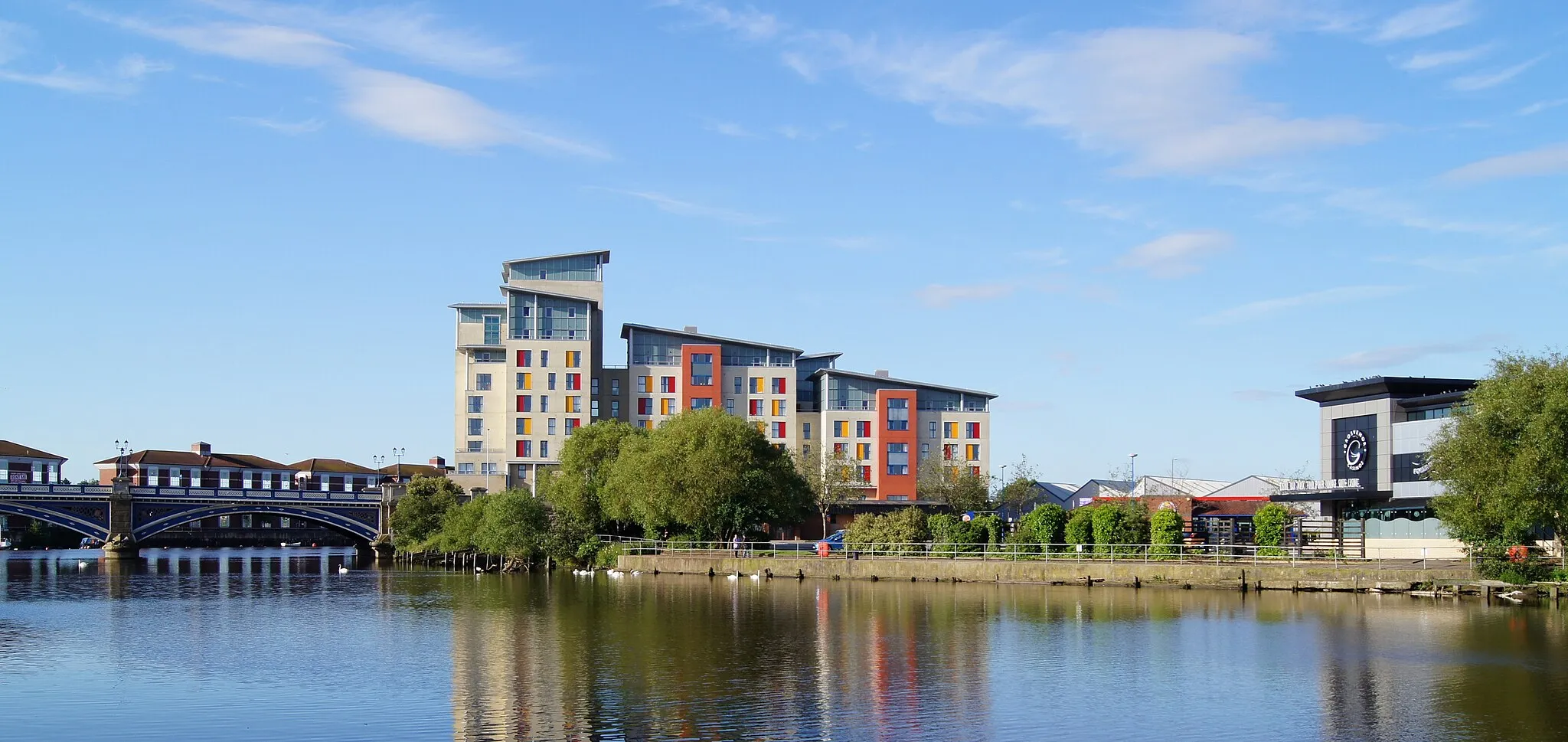 Photo showing: Chandlers Wharf across the River Tees at Stockton-on-Tees. Picture shows Victoria Bridge, Mezzino student accommodation and Grosvenor Casino.