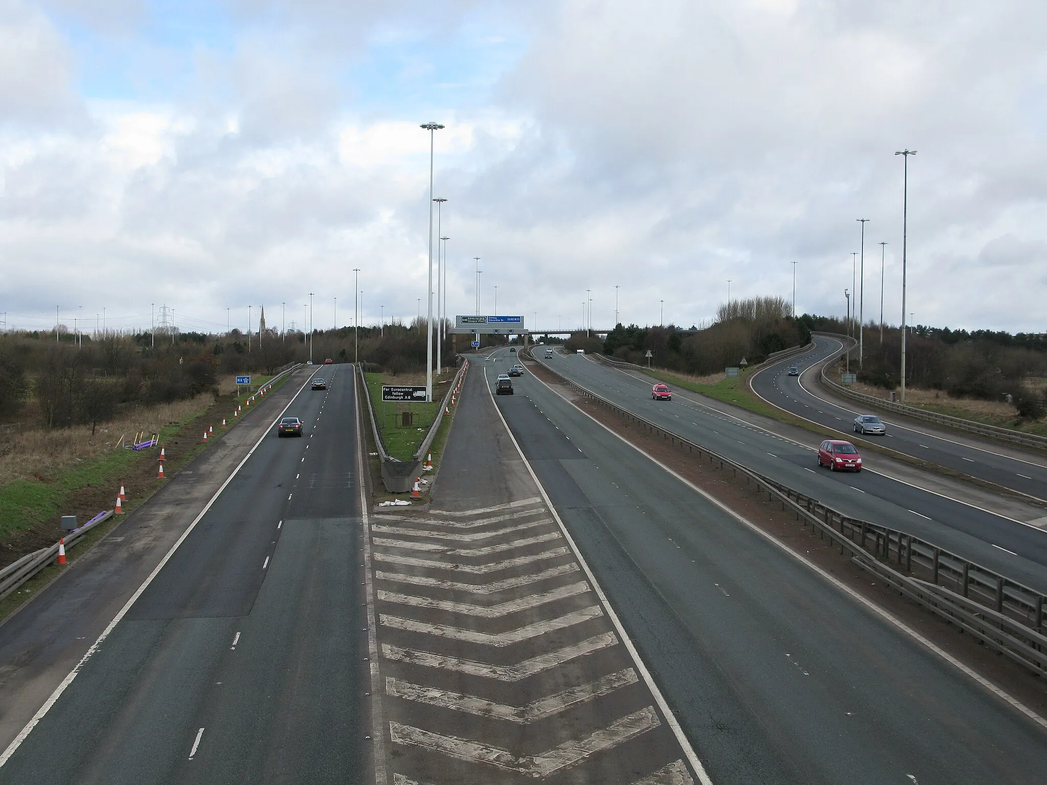 Photo showing: M73 South of the Baillieston Interchange Looking north along the M73 with slip roads leading to and coming from the M8.