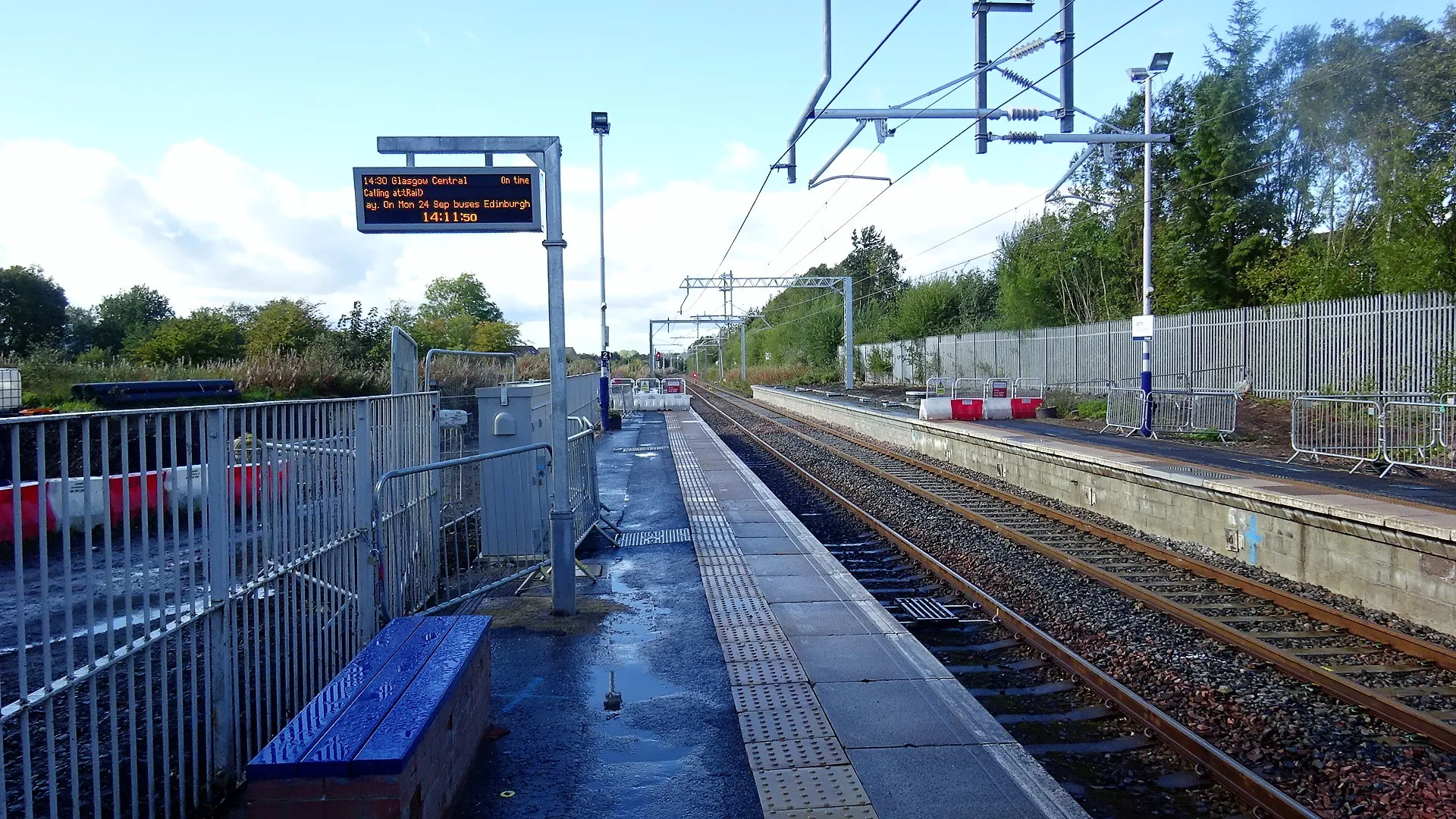 Photo showing: Carfin railway station, Shotts line, North Lanarkshire. View west towards Holytown with improvement works underway - platform extensions.