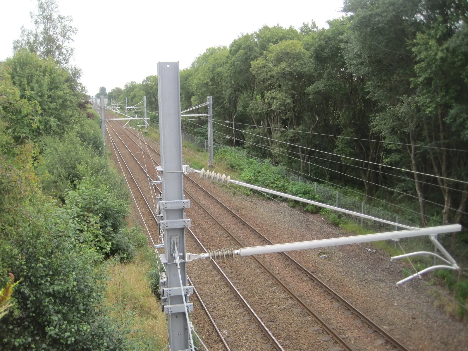 Photo showing: Stepps Road railway station (site), North Lanarkshire Opened in 1831 by the Garnkirk & Glasgow Railway (needs confirmation), later part of the Caledonian Railway, this station was originally called 'Steps Road'. It closed in 1962.
View east towards the replacement Stepps station opened in 1989, and Edinburgh.