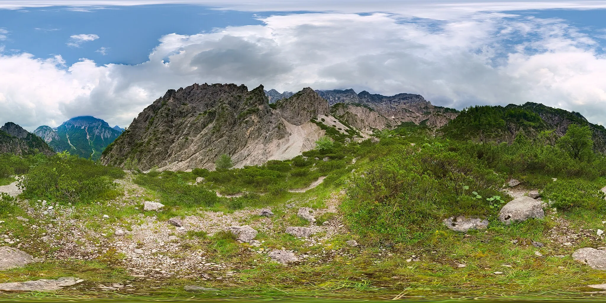 Photo showing: This is a spherical panoramic along the hiking trail to Haindlkarhütte, Gesäuse, Austria.  Uphill the mountains around Hochtor can be seen, and downhill in the background the Buchstein.  Haindlkarhütte itself is not visible, but the flag on a boulder and viewpoint close by it is visible.  This picture was created from two exposure layers with 16 images each, so from a total of 32 individual shots.