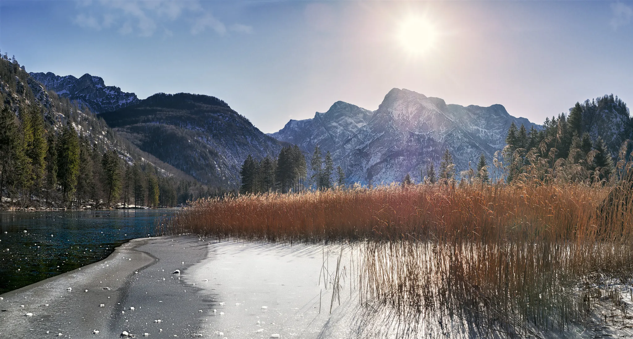 Photo showing: 500px provided description: Winterwalk along a lake ?
My feet carry me,

But will the ice carry my feet? [#trees ,#sky ,#landscape ,#lake ,#forest ,#winter ,#water ,#cold ,#blue ,#sun ,#beautiful ,#wood ,#mountain ,#ice ,#reed ,#cane ,#salzkammergut ,#almsee ,#almtal ,#gr?nau]