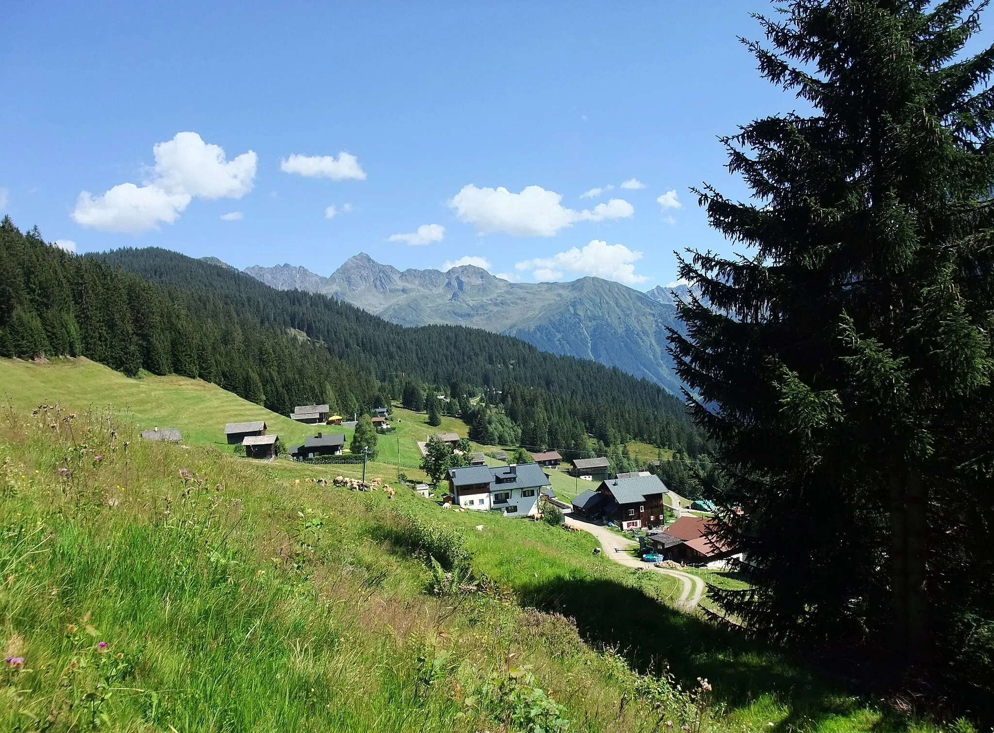 Photo showing: Montafon is a 39 km long valley situated in the westernmost federal state Vorarlberg of Austria. View to the community of Kristberg.