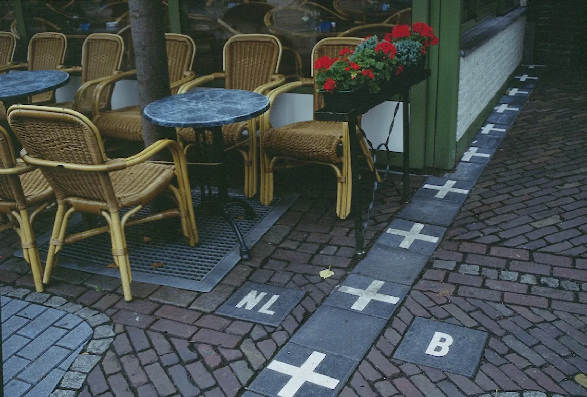 Photo showing: Café in Baarle-Nassau (Netherlands), on the border with Belgium. The border is marked on the ground (N119/N260).