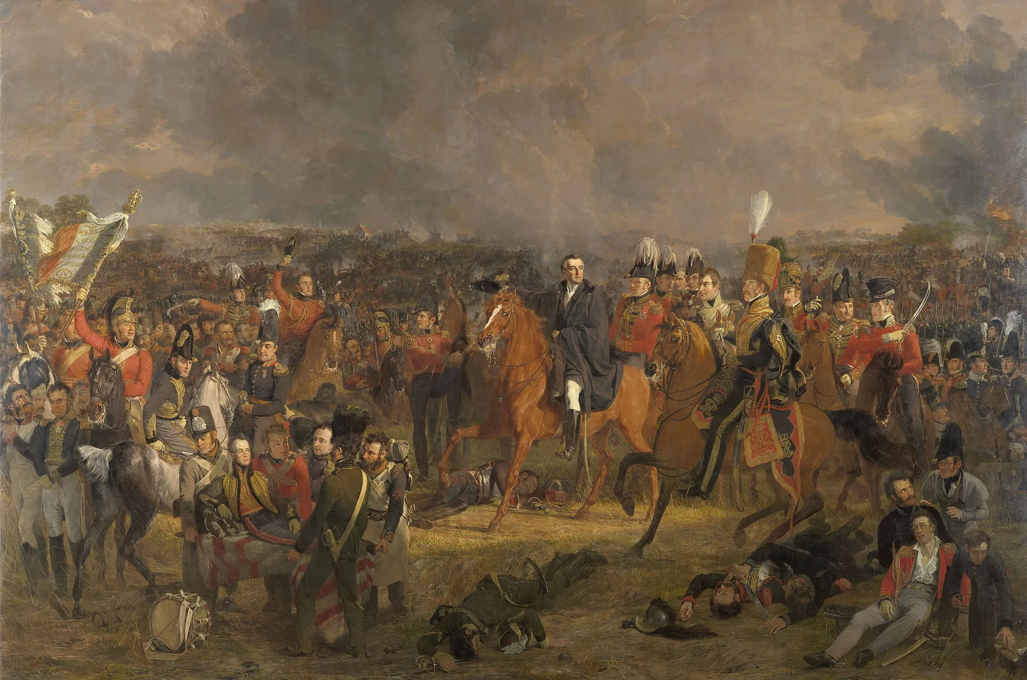 Photo showing: The Battle of Waterloo, 18 June 1815. View of the battle field on the moment that the British commander Wellington receives the message that help from Prussian troops is underway. Bottom left the wounded Prince of Orange is being carried away. The commanders and other officers are depicted in the center on horseback. Bottom right a number of wounded and dead soldiers. In the background the battle is raging. The people portrayed include Lord Uxbridge, Sir Rowland Hill, Staff Colonel Sir William Delancey, Major-General George Cooke, Colonel Harvey, Colonel Campbell, lieutenant-general Don Miguel Ricardo de Álava, lieutenant-colonel F.C. Ponsonby, Major William Thornhill, Jean Victor, baron De Constant de Rebeque, Colonel Sir John Elley, lieutenant-colonel Aberson, General-major A.K.J.G. d'Aubremé, Captain Aberson, Captain H. Roepel, Colonel H. Detmers, Major J.L.D. van der Smissen, Lieutenant-colonel A. van Thielen, Lieutenant-colonel Jhr. W.F. Boreel, Lieutenant-general D.H. Baron Chassé, Colonel Sir G.A. Wood, General Major J.B. Baon van Merlen, Lieutenant-general Ch. von Alten, Major General Sir Colin Halkett, Lieutenant-Colonel William George Harris, Captain C. Nepveu, Fitzroy James Henry Somerset, H.D. Graaf De Cruquenbourg, N.C. Ampt, General-Major Jhr. A.D. Trip, John William Fremantle, General-Major Graaf van Rheede, Major-General Lord Edward Somerset, Charles Gordon Lennox, Lord March, Colonel Dennis Pack, Major P.S.R. van Hooff, Major-general John Ormsby Vandeleur, Major Georg, Freiherr Baring, Colonel C. Von Ompteda, Colonel L.J.H.F. De Caylar and Général de Division Cambronne, Maréchal de Camp.