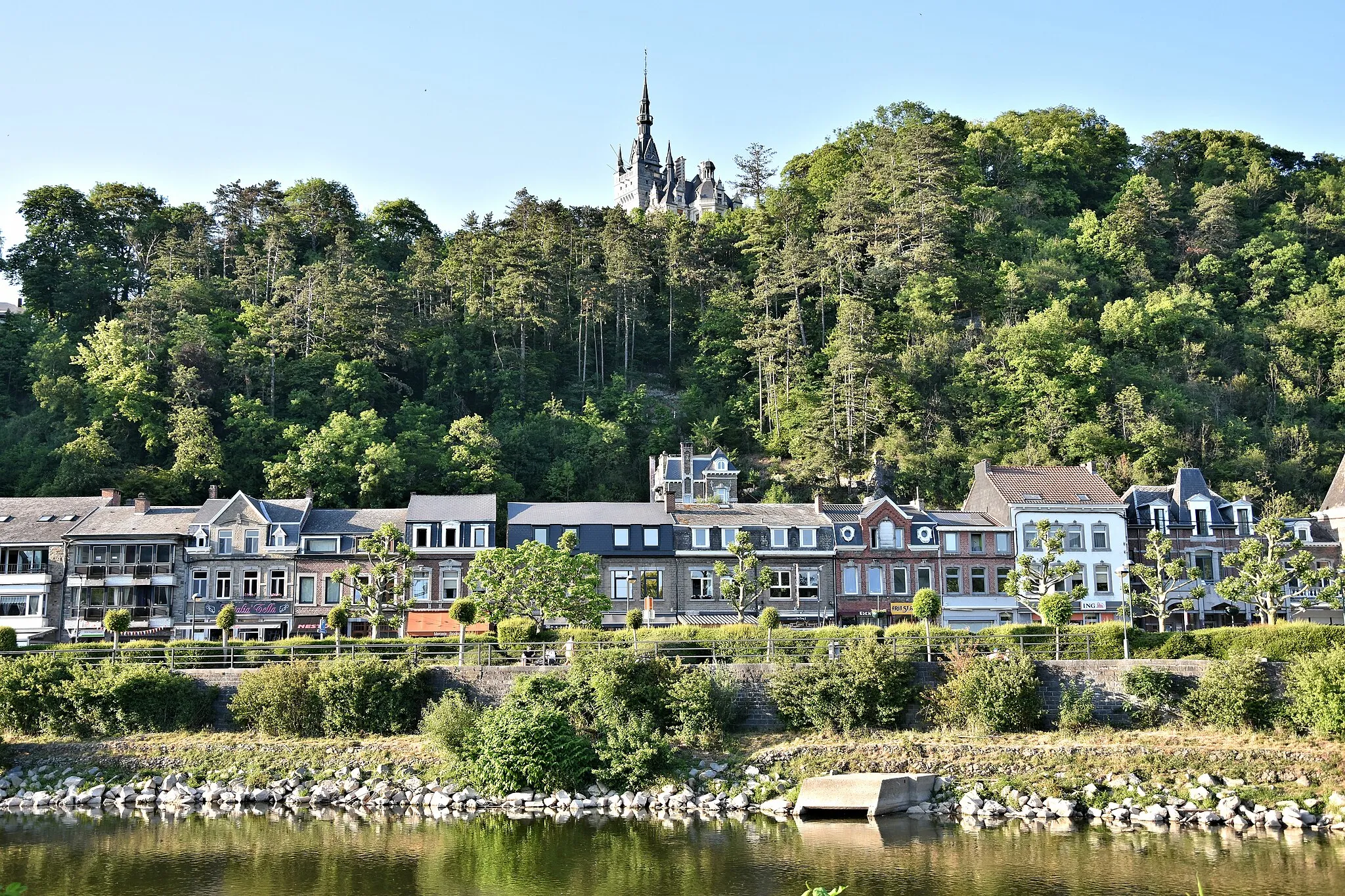 Photo showing: View of commercial buildings, the banks of the Ourthe, the river and Chateau Le Fy.