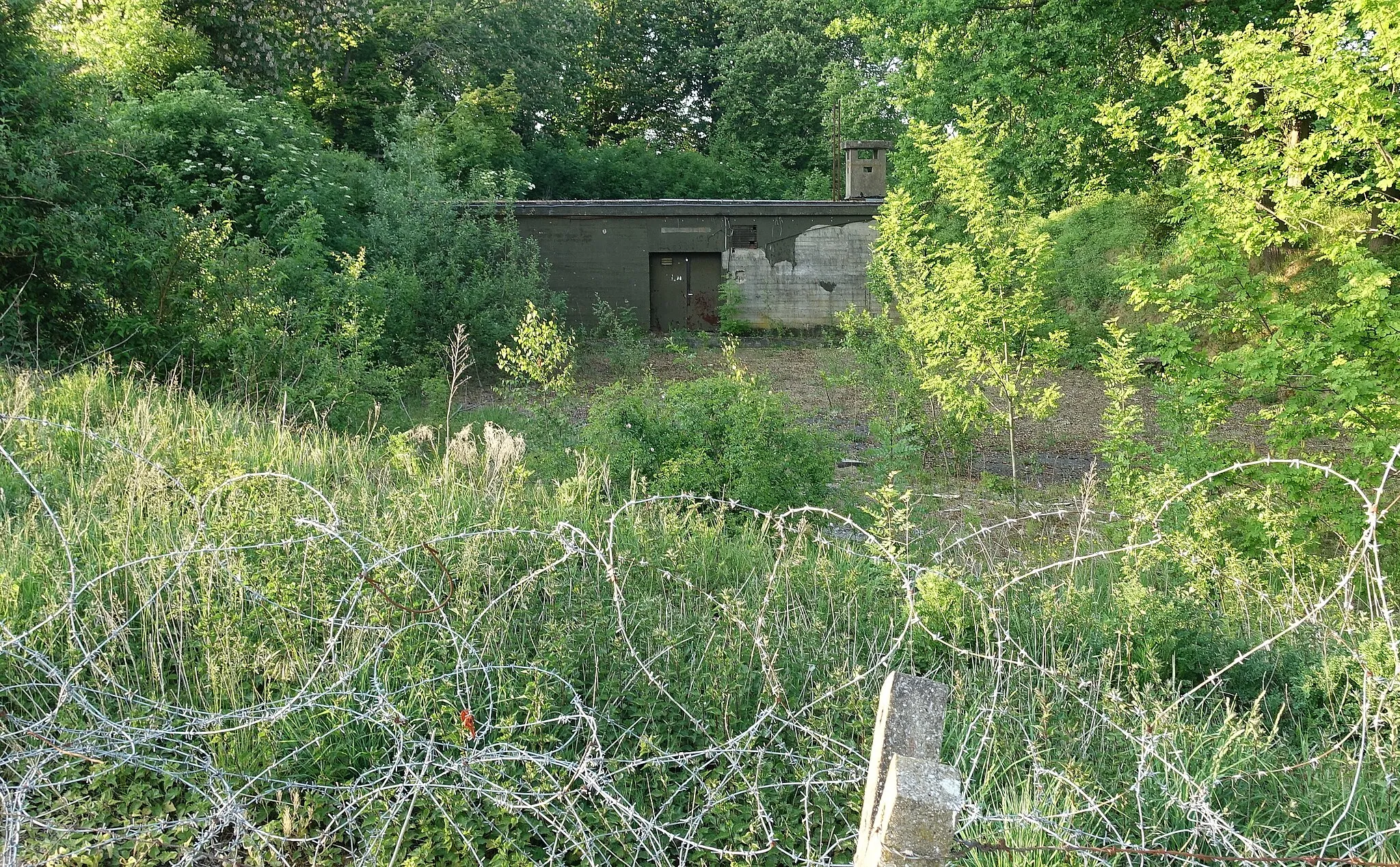 Photo showing: Entrance to previous COC (combat operation center / WingOPS) command bunker of airfield Brustem (1964)