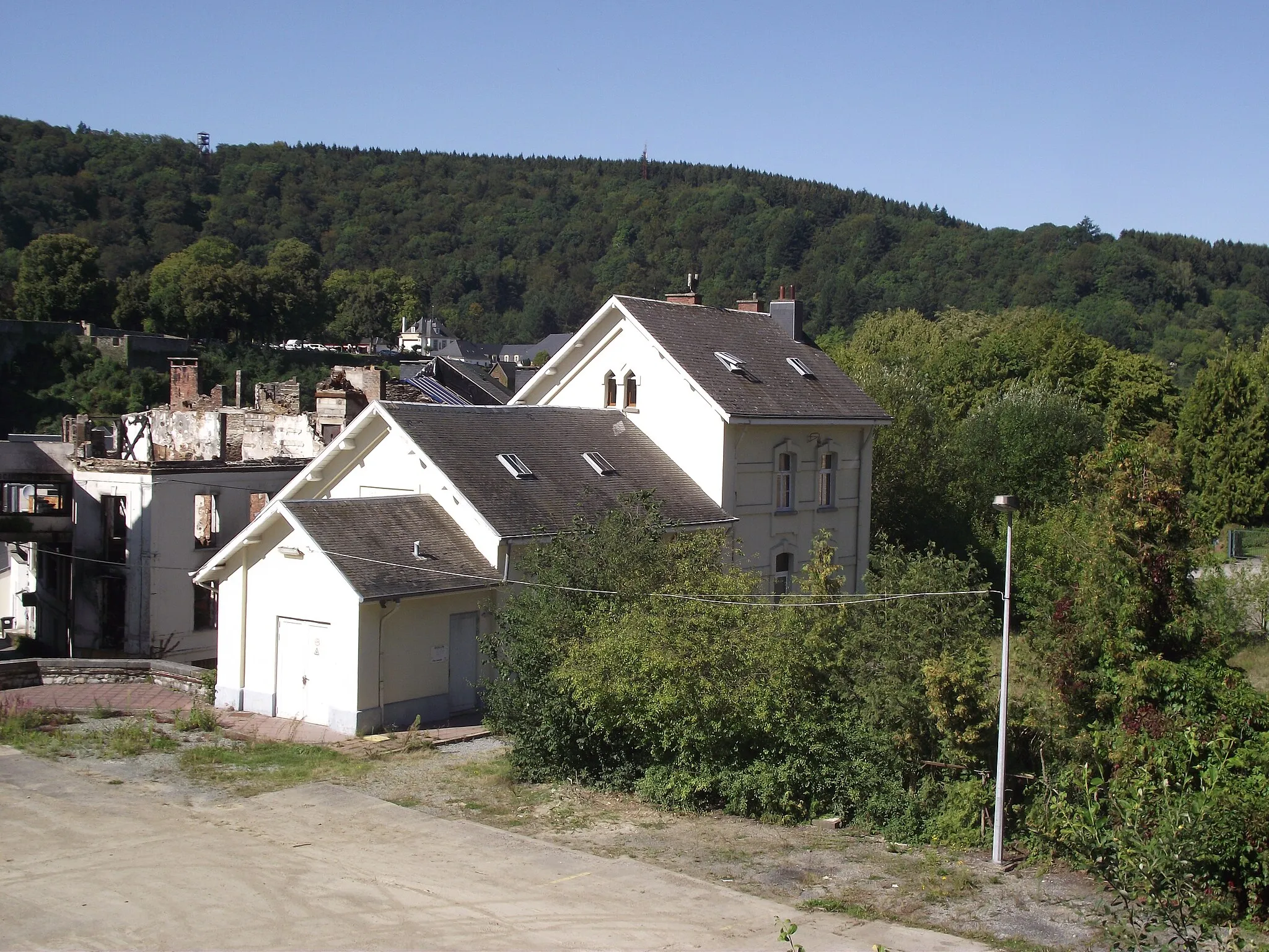 Photo showing: Ex-SNCV station of Bouillon stil in use as an office by the TEC and ex-railway yard now partly used for buses.