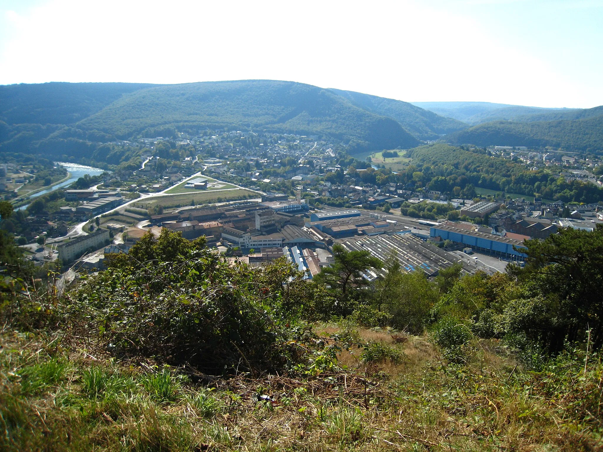 Photo showing: View over Revin taken from the last hairpin on the Cote du Malgre Tout