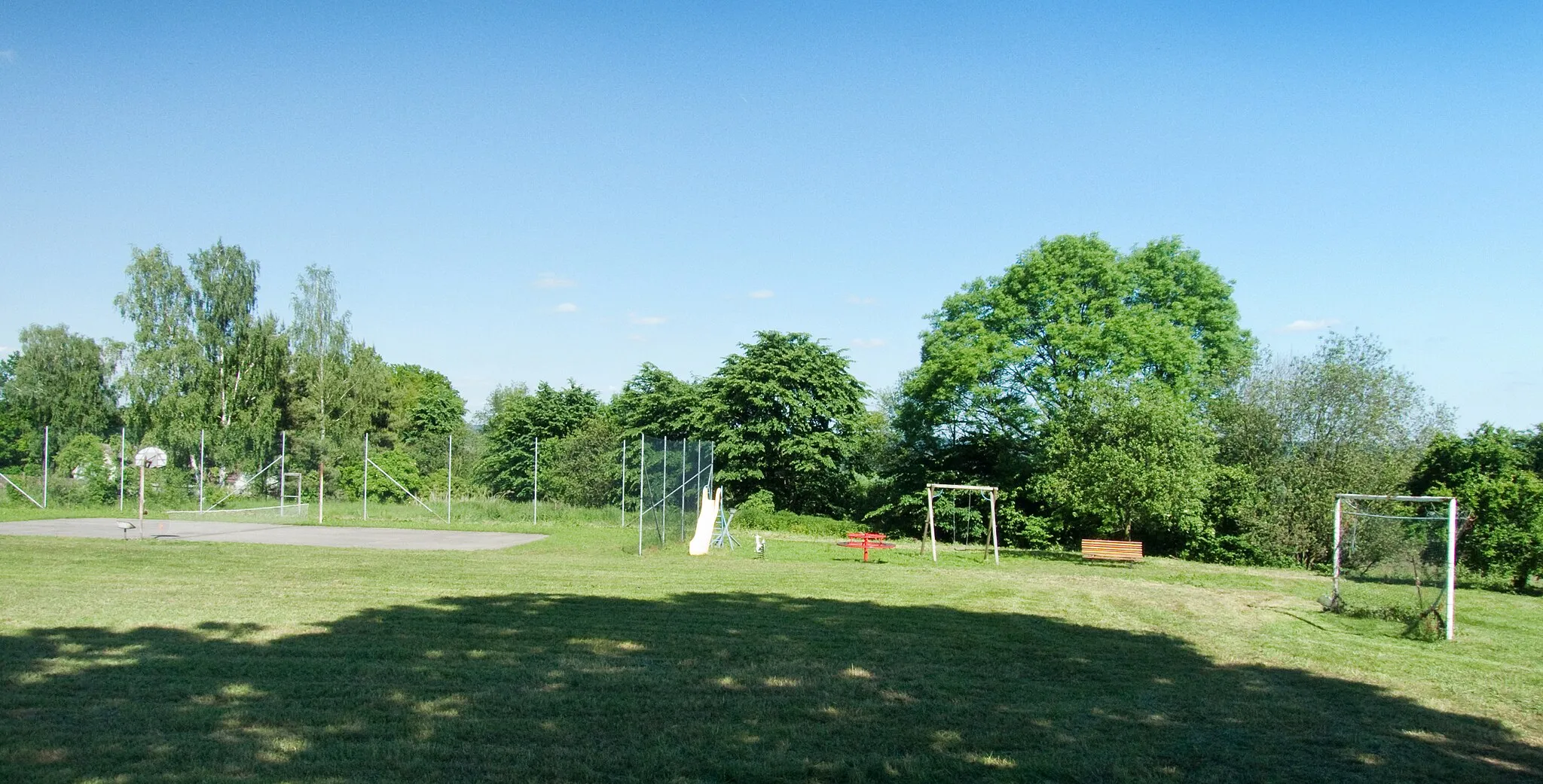 Photo showing: Football pitch and playground in the village of Višňová, Jindřichův Hradec district, Czech Republic