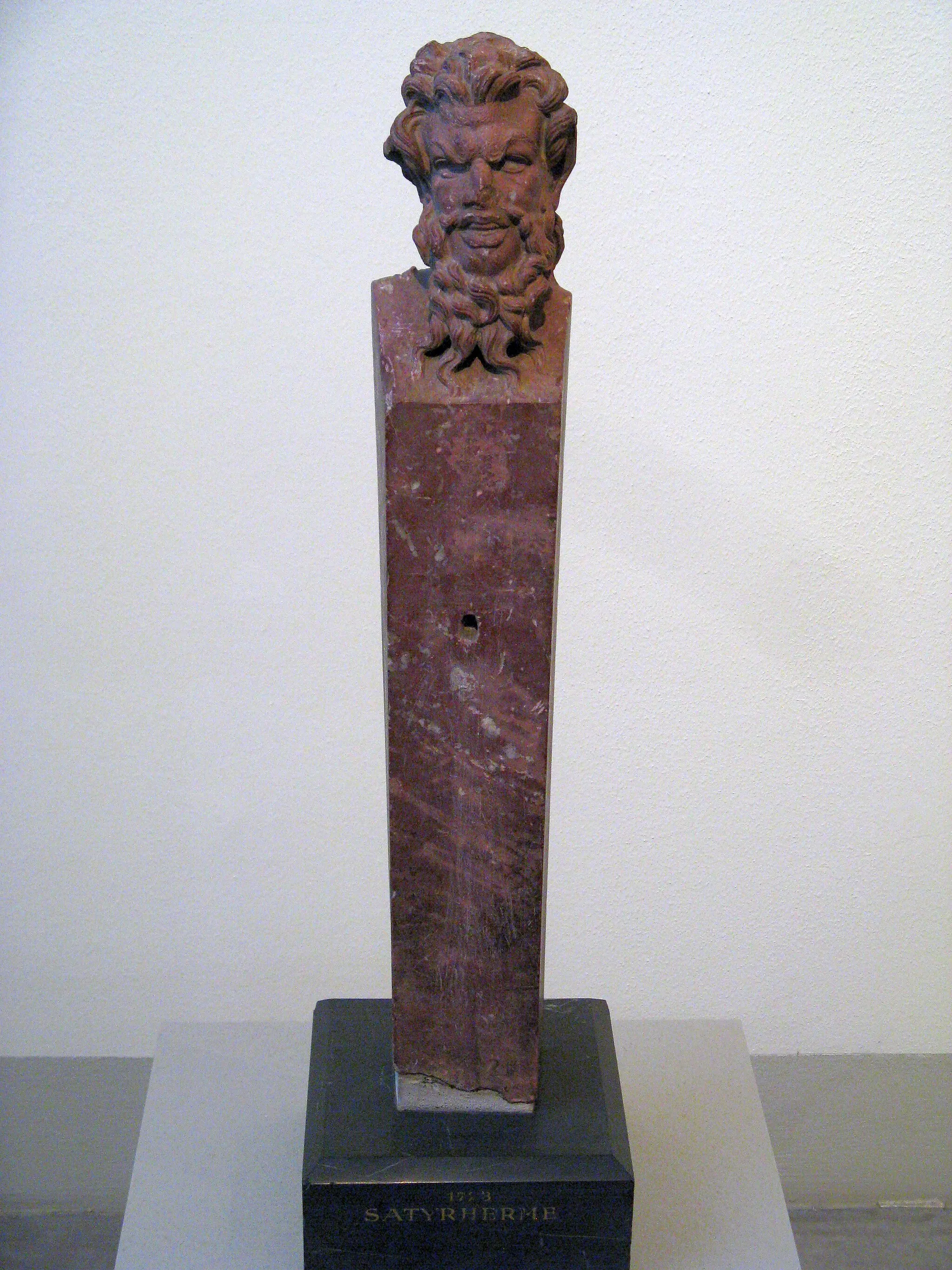 Photo showing: Hermai of Pan found at the maeander valley near Magnesia. Roman copy from the beginning 1st century possibly of a high hellenistic original. Made of krian red marble, missing pupils and phallus were made of a different material. Antikensammlung Berlin.