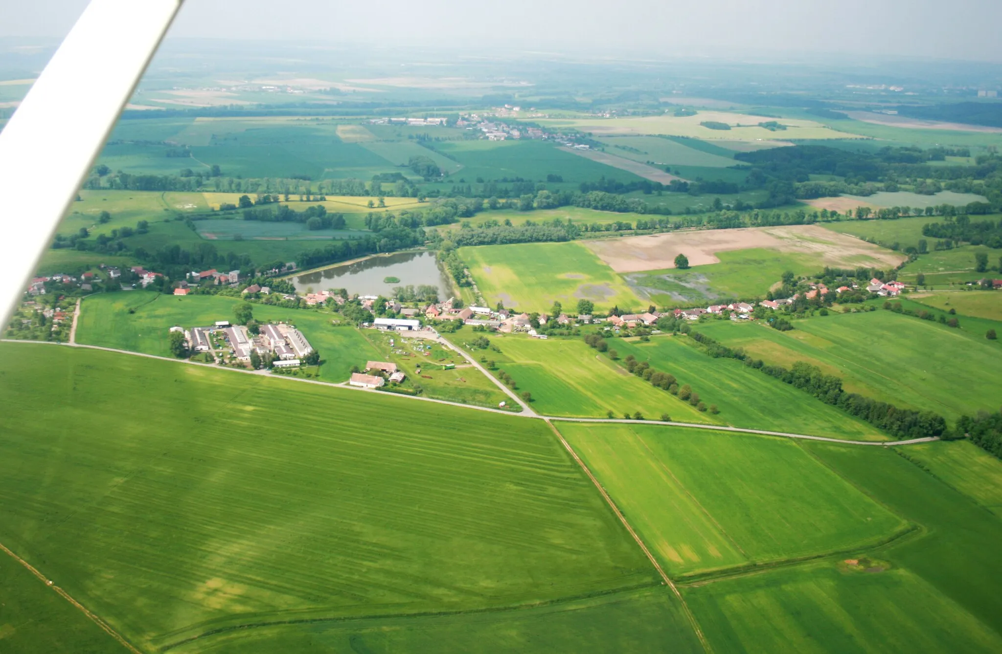 Photo showing: Small village Starý Ples, part of Jaroměř from air, Josefov Meadows Bird Reserve to the left, east Bohemia, Czech Republic