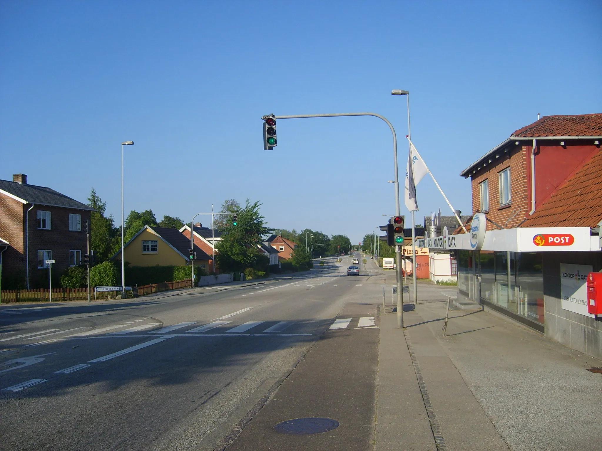 Photo showing: Main road Hovedvejen passing through the center of Hasselager, Denmark